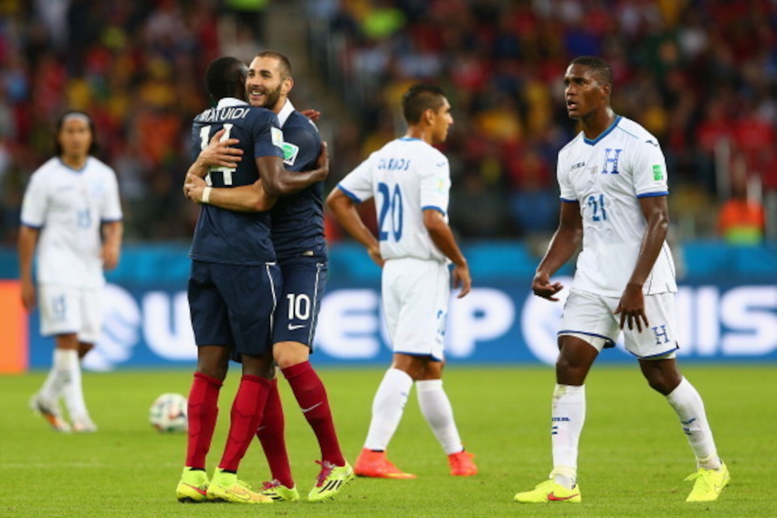PORTO ALEGRE, BRAZIL - JUNE 15: Karim Benzema of France (2nd L) celebrates after scoring his team's third goal with Blaise Matuidi as Brayan Beckeles of Honduras looks on during the 2014 FIFA World Cup Brazil Group E match between France and Honduras at PORTO ALEGRE, BRAZIL - JUNE 15: Karim Benzema of France (2nd L) celebrates after scoring his team's third goal with Blaise Matuidi as Brayan Beckeles of Honduras looks on during the 2014 FIFA World Cup Brazil Group E match between France and Honduras at
