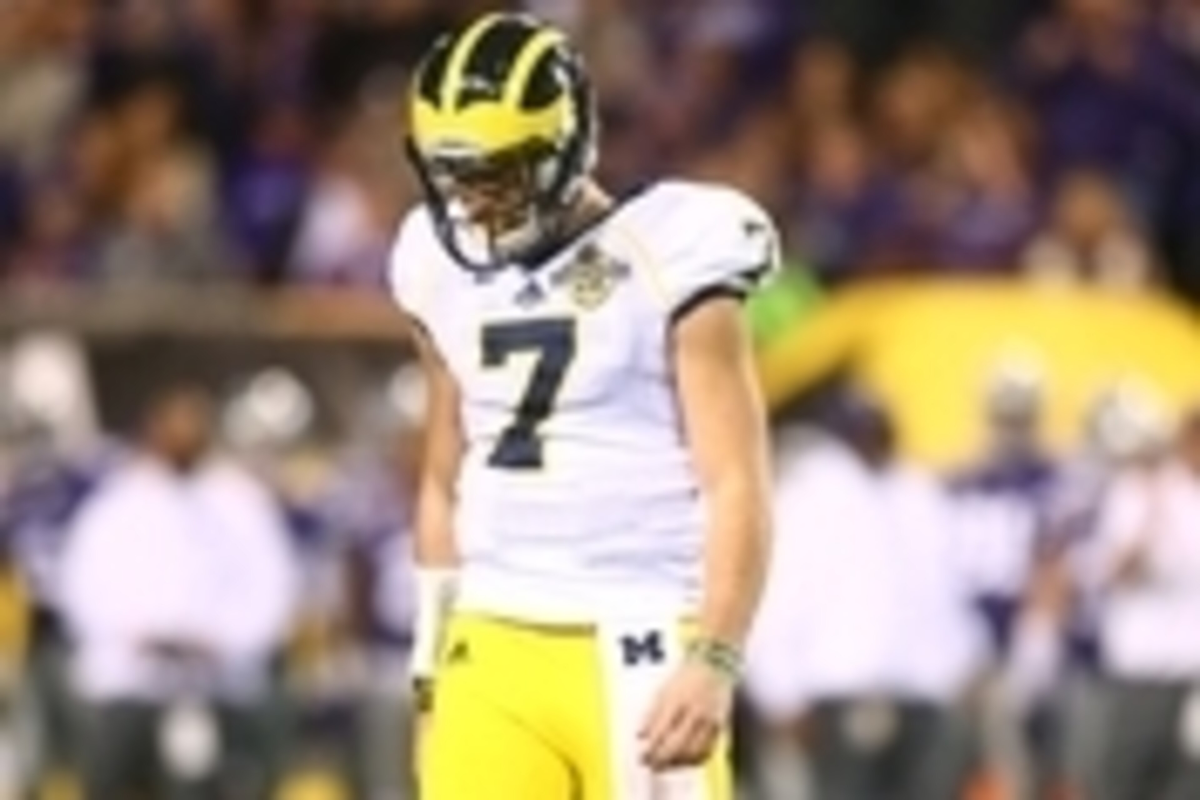 Dec 28, 2013; Tempe, AZ, USA; Michigan Wolverines quarterback Shane Morris reacts in the fourth quarter against the Kansas State Wildcats during the Buffalo Wild Wings Bowl at Sun Devil Stadium. Kansas State defeated Michigan 31-14. Mandatory Credit: Mark