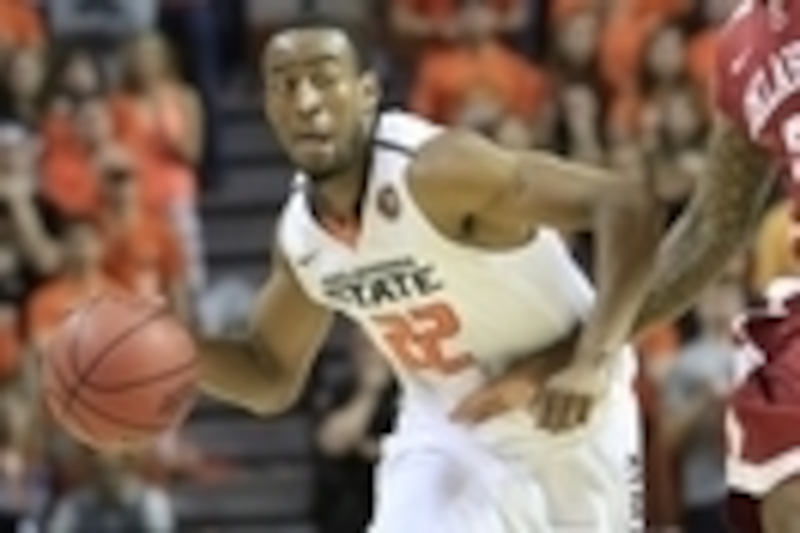 Feb 15, 2014; Stillwater, OK, USA; Oklahoma State Cowboys guard Markel Brown (22) dribbles the ball as Oklahoma Sooners forward Cameron Clark (21) defends during the second half at Gallagher-Iba Arena. Oklahoma won 77-74. Mandatory Credit: Alonzo Adams-US Feb 15, 2014; Stillwater, OK, USA; Oklahoma State Cowboys guard Markel Brown (22) dribbles the ball as Oklahoma Sooners forward Cameron Clark (21) defends during the second half at Gallagher-Iba Arena. Oklahoma won 77-74. Mandatory Credit: Alonzo Adams-US