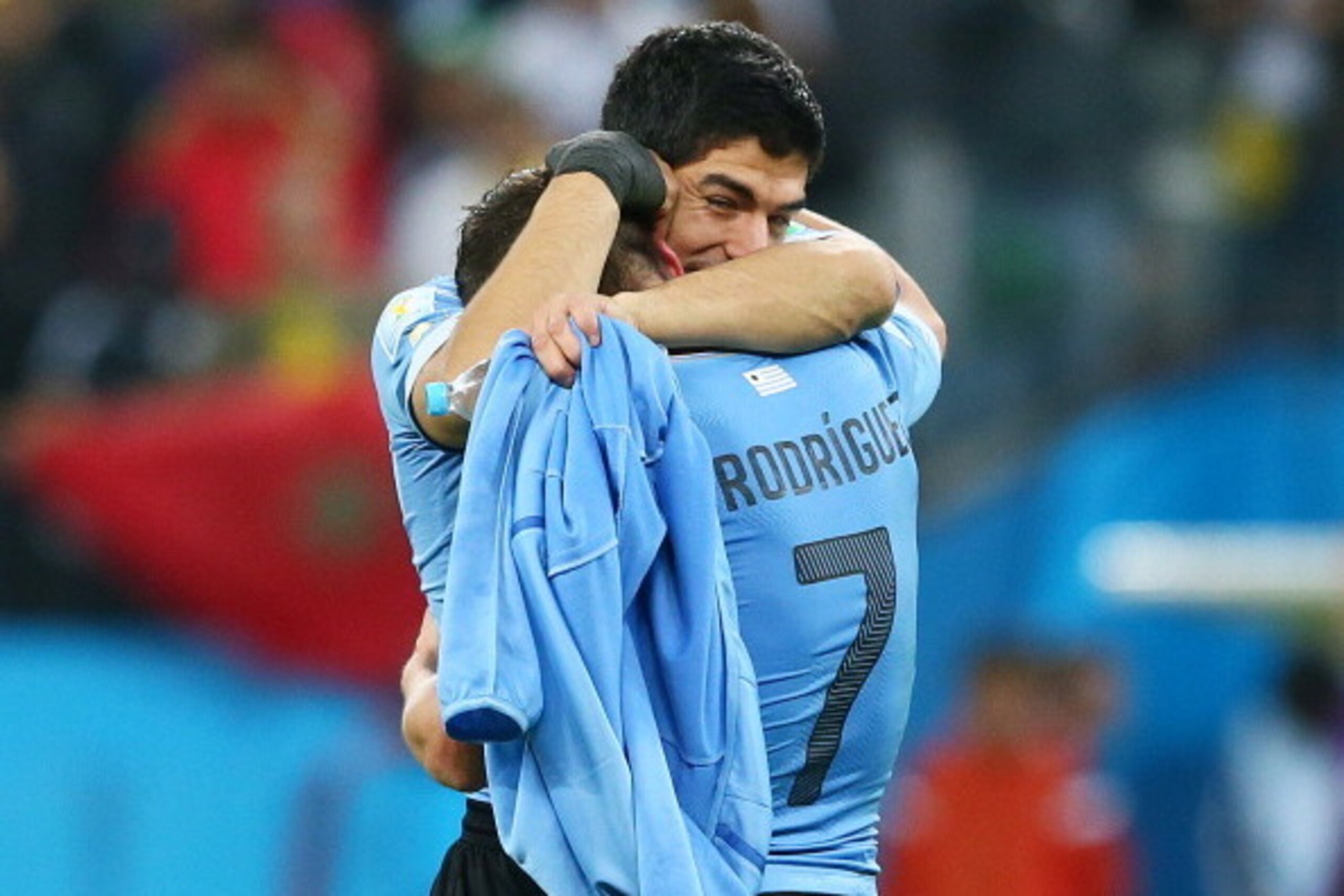 SAO PAULO, BRAZIL - JUNE 19: Luis Suarez of Uruguay hugs teammate Cristian Rodriguez after defeating England 2-1 during the 2014 FIFA World Cup Brazil Group D match between Uruguay and England at Arena de Sao Paulo on June 19, 2014 in Sao Paulo, Brazil. SAO PAULO, BRAZIL - JUNE 19: Luis Suarez of Uruguay hugs teammate Cristian Rodriguez after defeating England 2-1 during the 2014 FIFA World Cup Brazil Group D match between Uruguay and England at Arena de Sao Paulo on June 19, 2014 in Sao Paulo, Brazil.