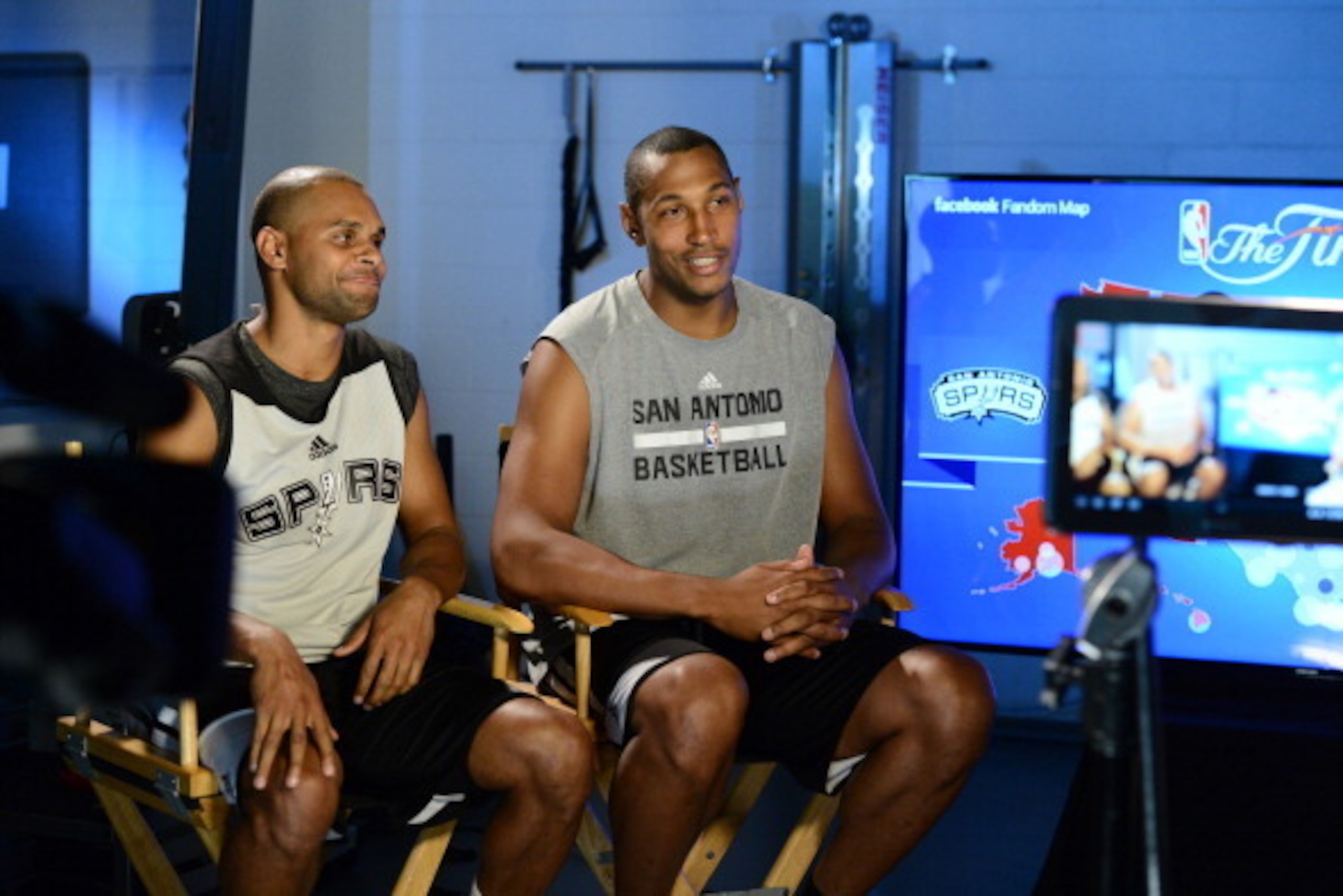 SAN ANTONIO, TX JUNE 07: Patty Mills and Boris Diaw of the San Antonio Spurs is interviewed by Joel Blank during the NBA Facebook Live fan chat at NBA Finals Media Availability on June 07, 2014 at the Spurs Practice Facility in San Antonio, Texas. NOTE TO