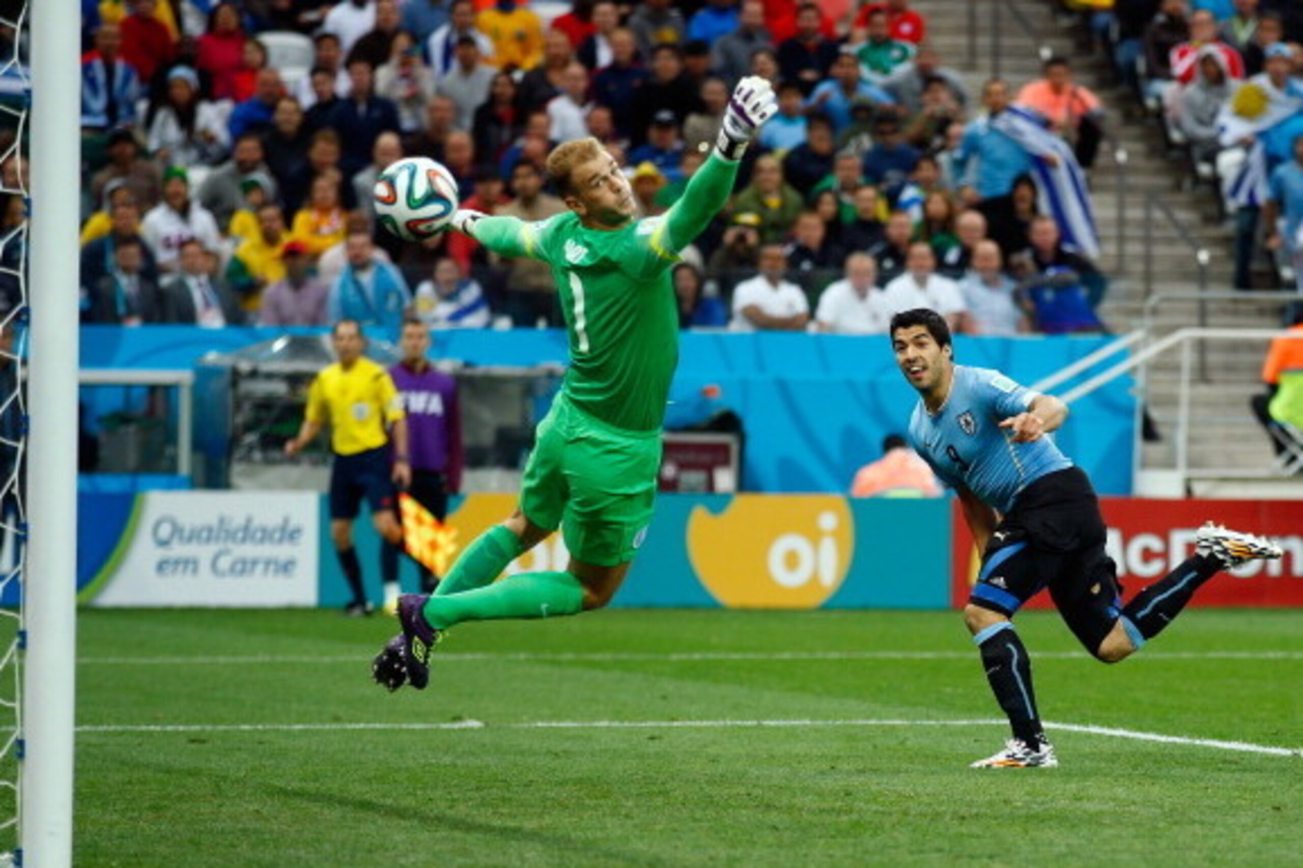 SAO PAULO, BRAZIL - JUNE 19:  Luis Suarez of Uruguay scores his team's first goal past Joe Hart of England during the 2014 FIFA World Cup Brazil Group D match between Uruguay and England at Arena de Sao Paulo on June 19, 2014 in Sao Paulo, Brazil.  (Photo