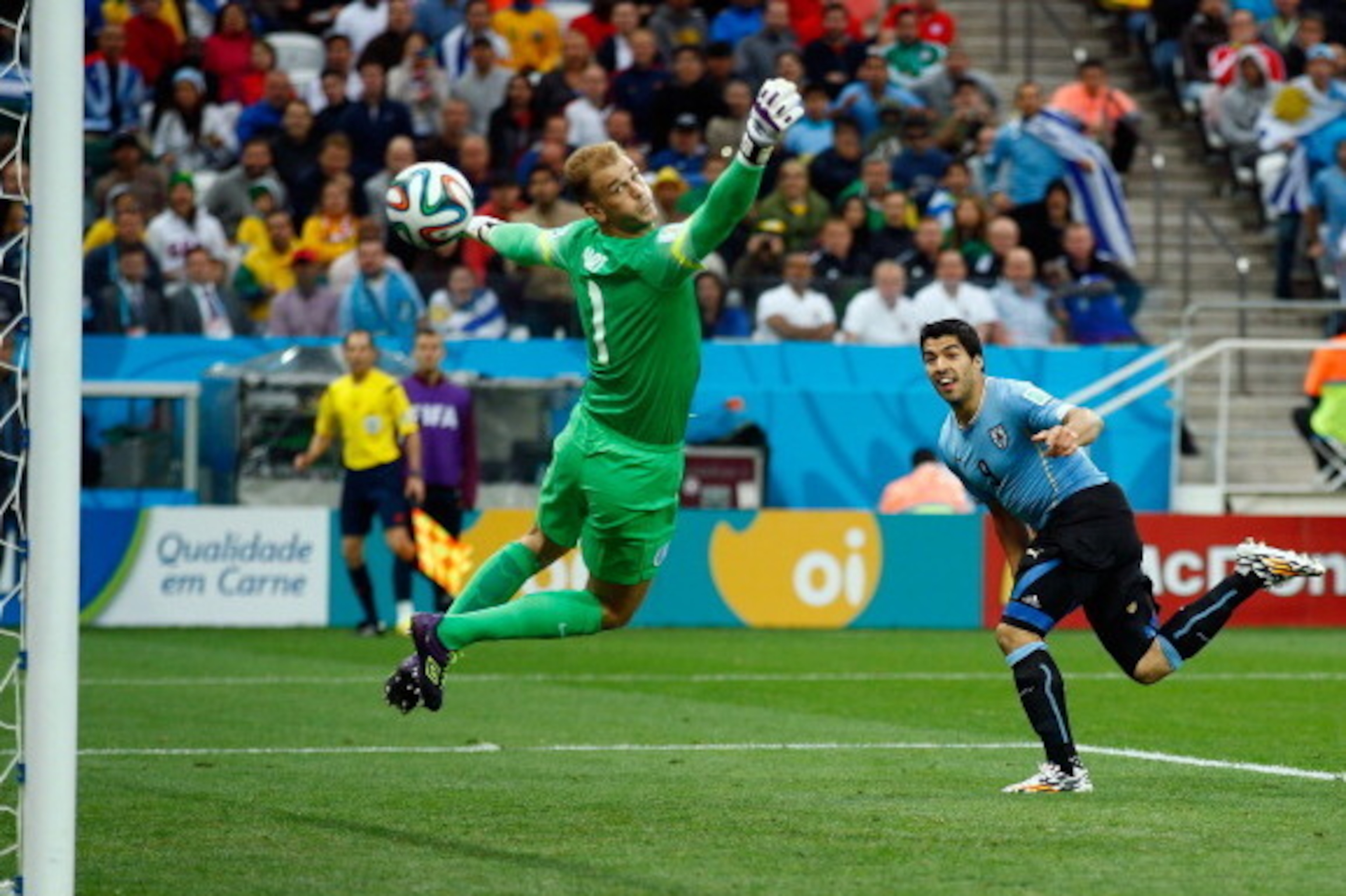 SAO PAULO, BRAZIL - JUNE 19:  Luis Suarez of Uruguay scores his team's first goal past Joe Hart of England during the 2014 FIFA World Cup Brazil Group D match between Uruguay and England at Arena de Sao Paulo on June 19, 2014 in Sao Paulo, Brazil.  (Photo