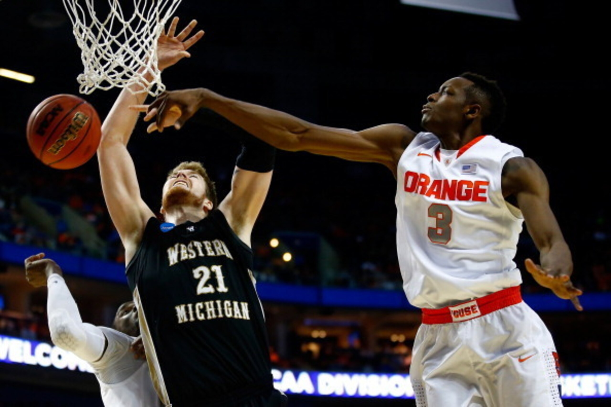 BUFFALO, NY - MARCH 20:  Jerami Grant #3 of the Syracuse Orange blocks a shot by Shayne Whittington #21 of the Western Michigan Broncos during the second round of the 2014 NCAA Men's Basketball Tournament at the First Niagara Center on March 20, 2014 in B