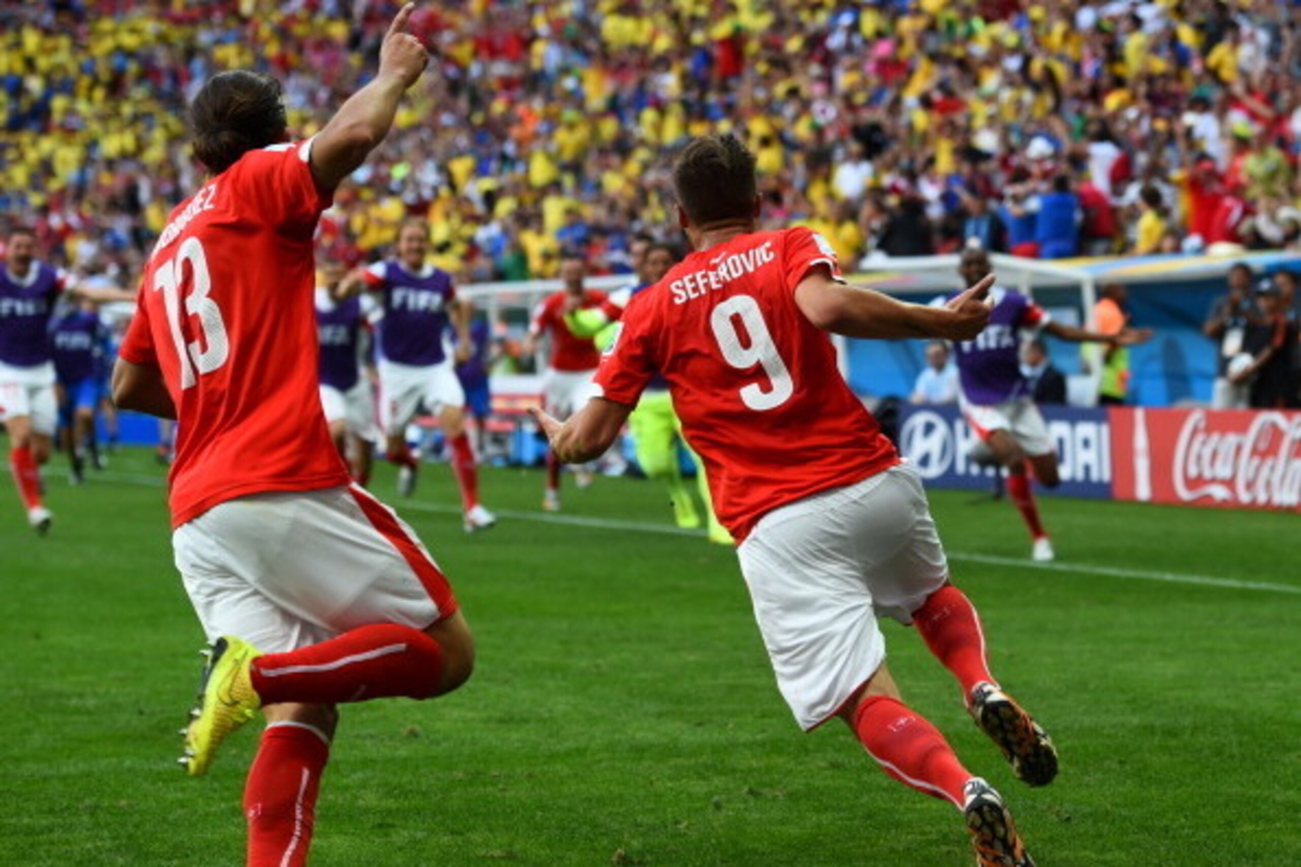 BRASILIA, BRAZIL - JUNE 15:  Haris Seferovic of Switzerland (R) and Ricardo Rodriguez celebrate after Switzerland's secund goal during the 2014 FIFA World Cup Brazil Group E match between Switzerland and Ecuador at Estadio Nacional on June 15, 2014 in Bra