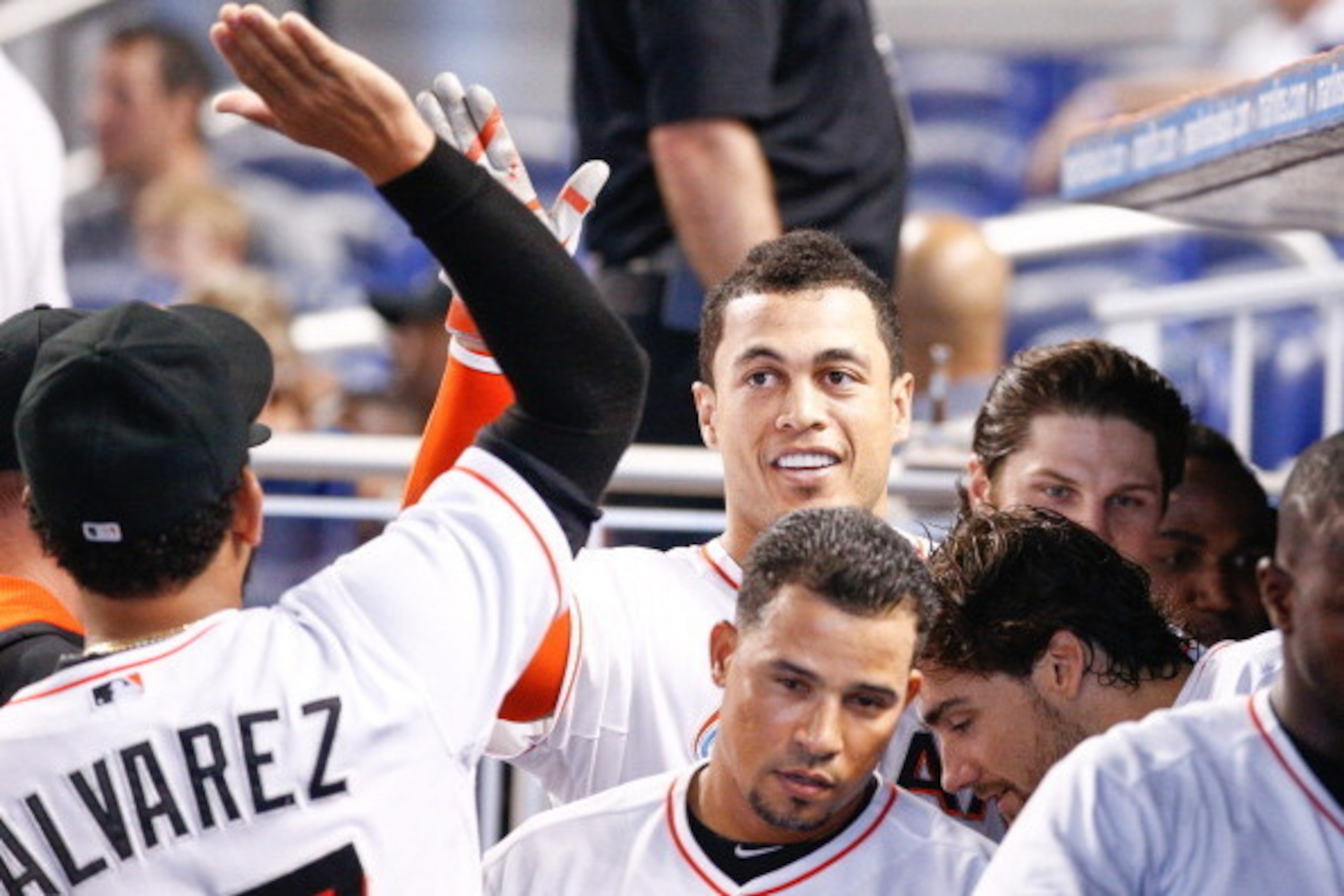 MIAMI, FL - JUNE 18: Giancarlo Stanton #27 of the Miami Marlins celebrates with teammates after hitting a home run during the first inning of the game against the Chicago Cubs  at Marlins Park on June 18, 2014 in Miami, Florida.  (Photo by Rob Foldy/Getty