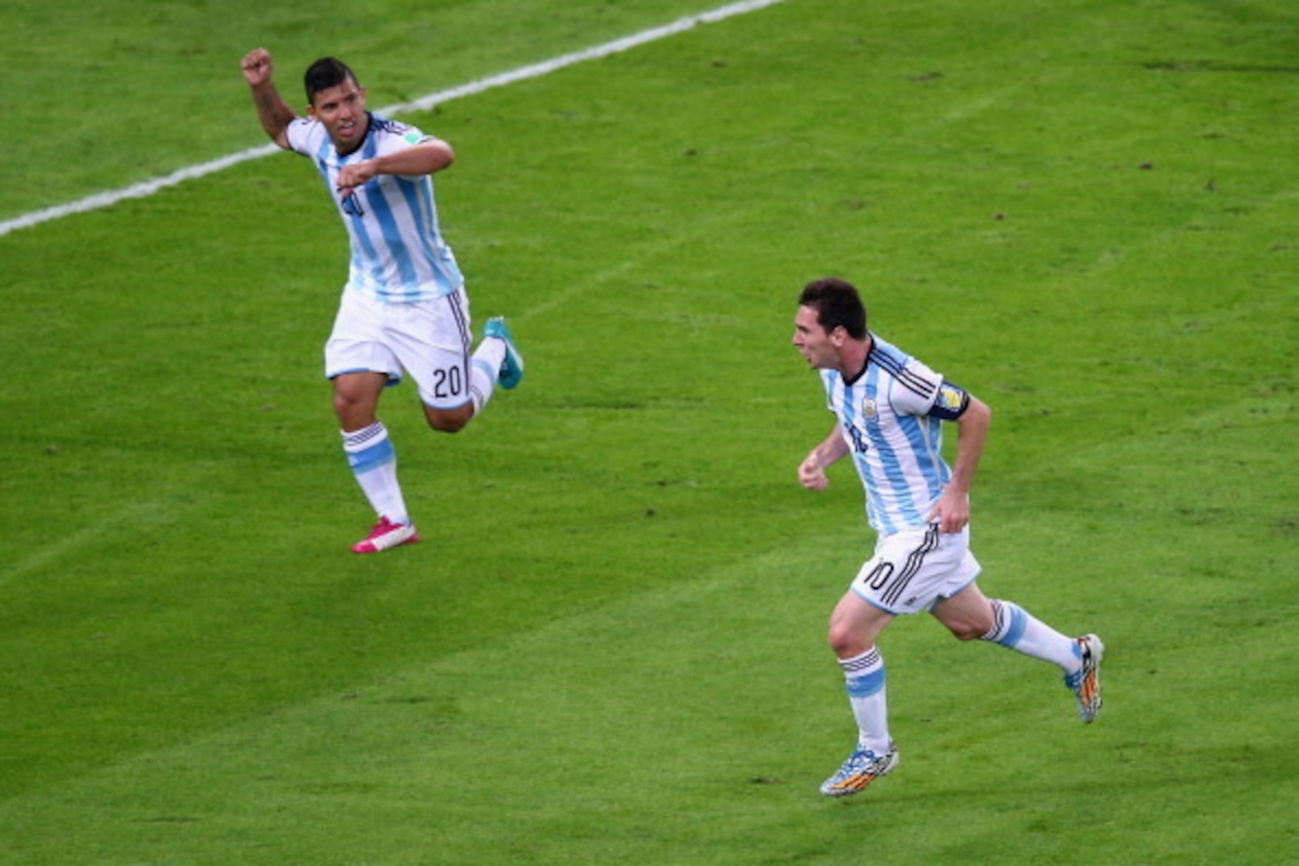 RIO DE JANEIRO, BRAZIL - JUNE 15:  Lionel Messi of Argentina (R) reacts after scoring his team's second goal with Sergio Aguero during the 2014 FIFA World Cup Brazil Group F match between Argentina and Bosnia-Herzegovina at Maracana on June 15, 2014 in Ri