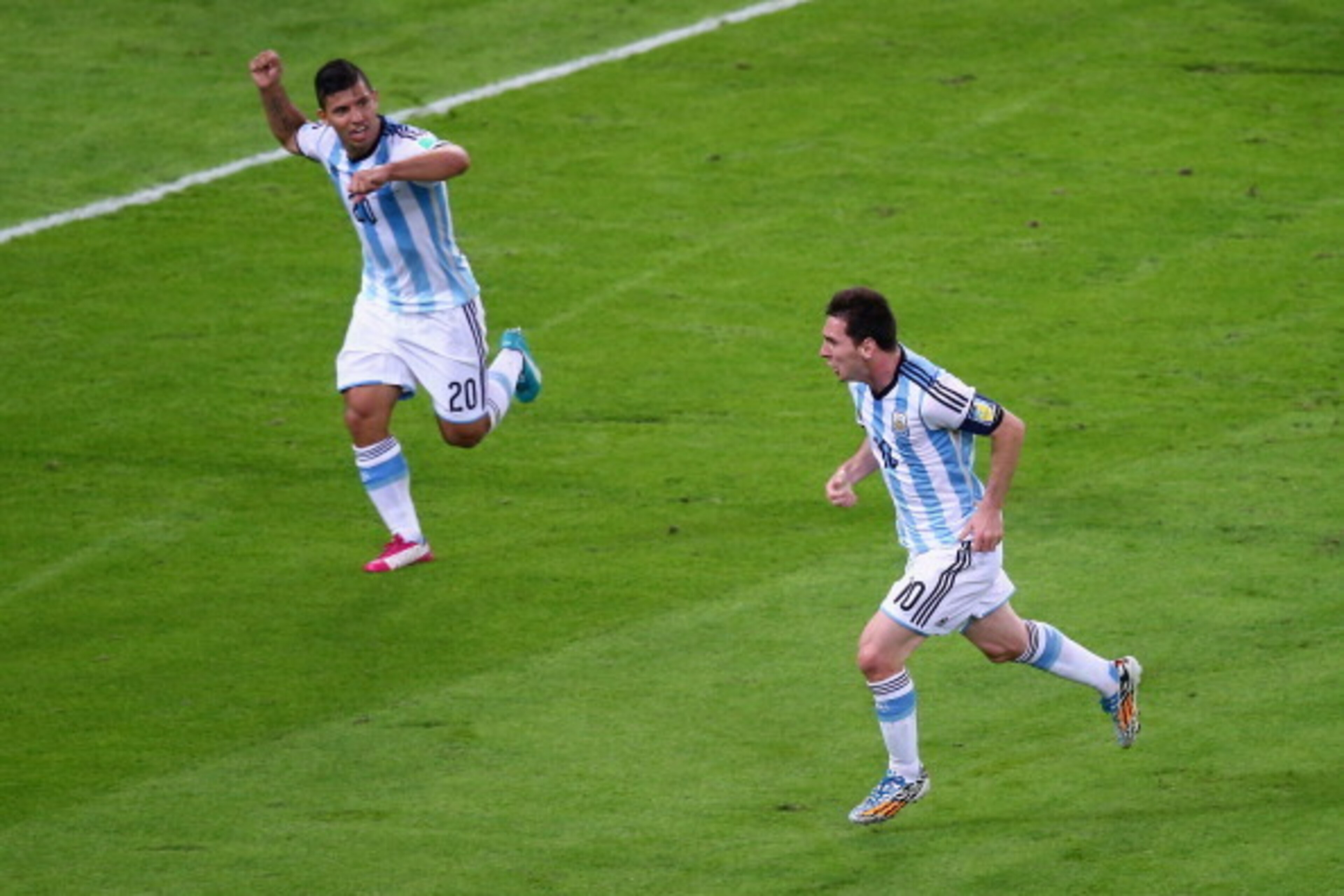 RIO DE JANEIRO, BRAZIL - JUNE 15:  Lionel Messi of Argentina (R) reacts after scoring his team's second goal with Sergio Aguero during the 2014 FIFA World Cup Brazil Group F match between Argentina and Bosnia-Herzegovina at Maracana on June 15, 2014 in Ri