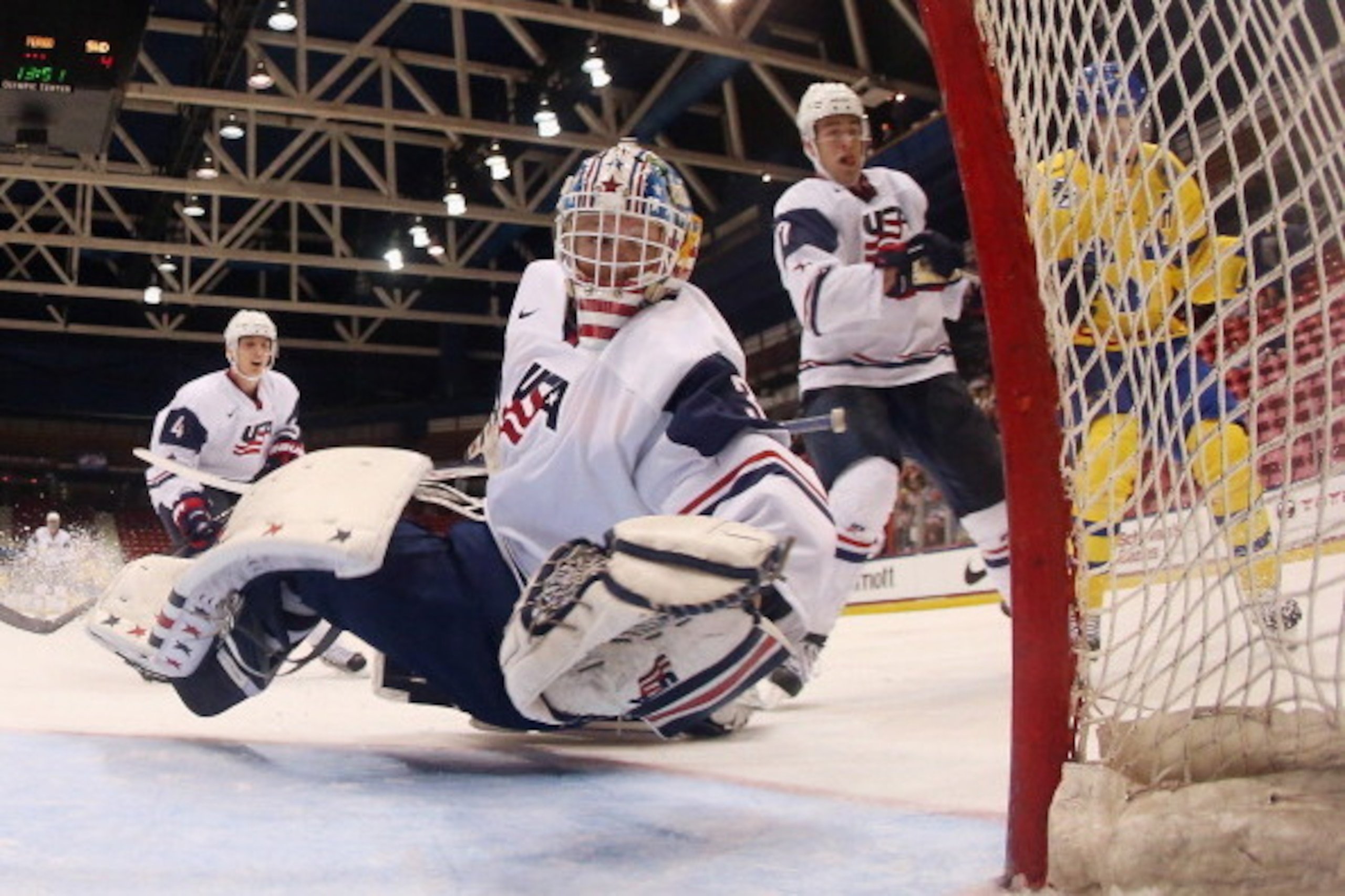 LAKE PLACID, NY - AUGUST 07: Thatcher Demko #30 of Team USA makes the save against Team Sweden during the 2013 USA Hockey Junior Evaluation Camp at the Lake Placid Olympic Center on August 7, 2013 in Lake Placid, New York. Sweden shut out the USA 4-0. ( LAKE PLACID, NY - AUGUST 07: Thatcher Demko #30 of Team USA makes the save against Team Sweden during the 2013 USA Hockey Junior Evaluation Camp at the Lake Placid Olympic Center on August 7, 2013 in Lake Placid, New York. Sweden shut out the USA 4-0. (