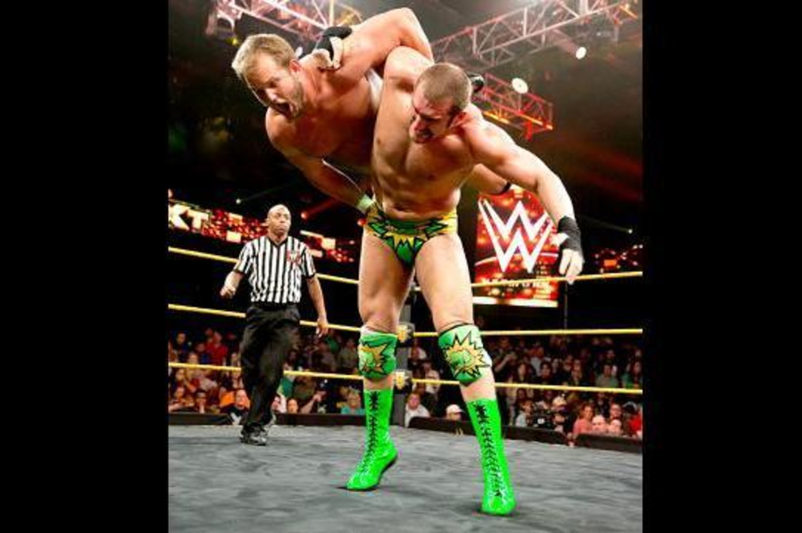Mojo Rawley hip-tosses Garrett Dylan.