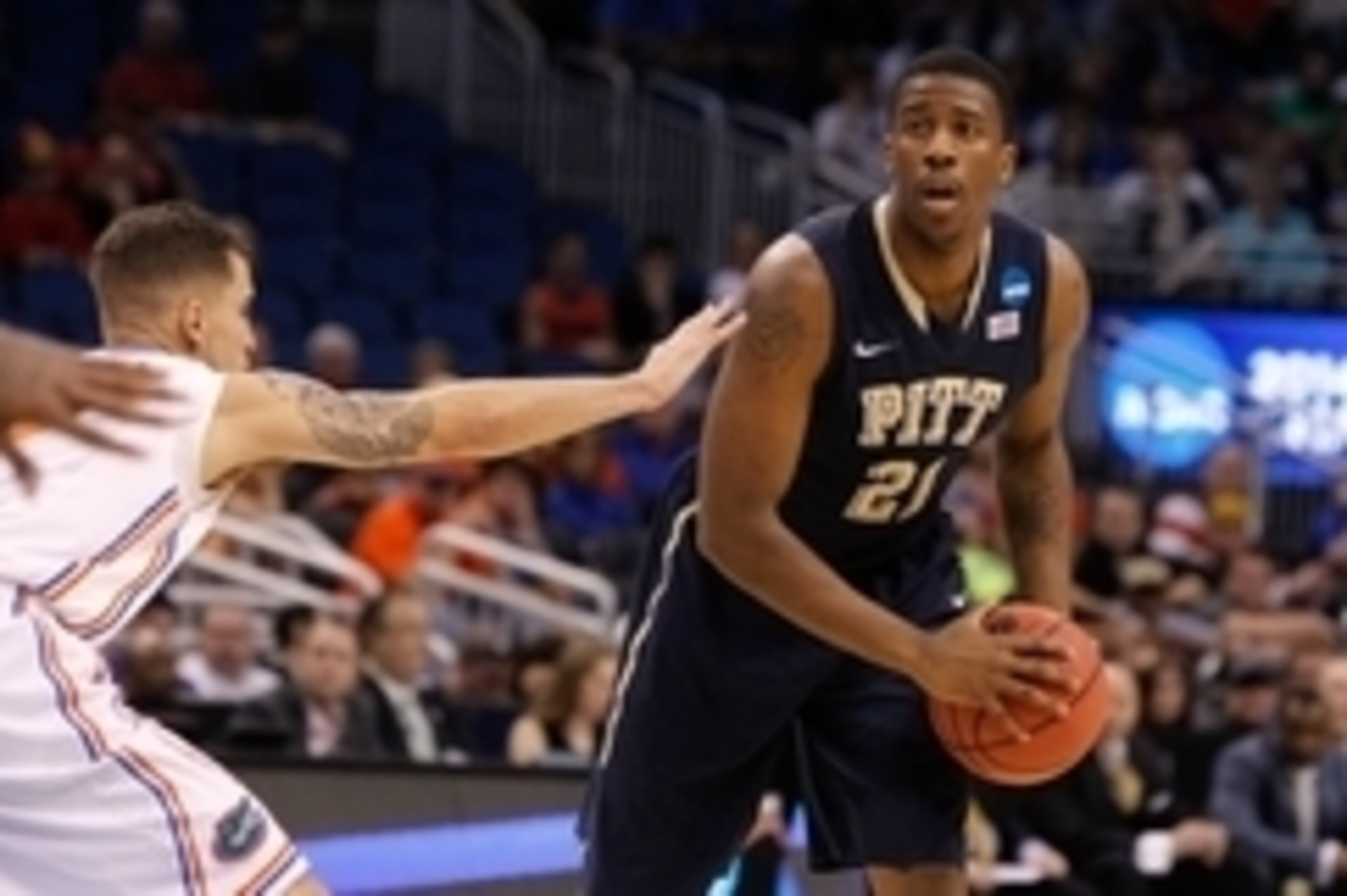 Mar 22, 2014; Orlando, FL, USA; Pittsburgh Panthers forward Lamar Patterson (21) passes the ball as Florida Gators guard Scottie Wilbekin (5) defends in the first half of a men's college basketball game during the third round of the 2014 NCAA Tournament a