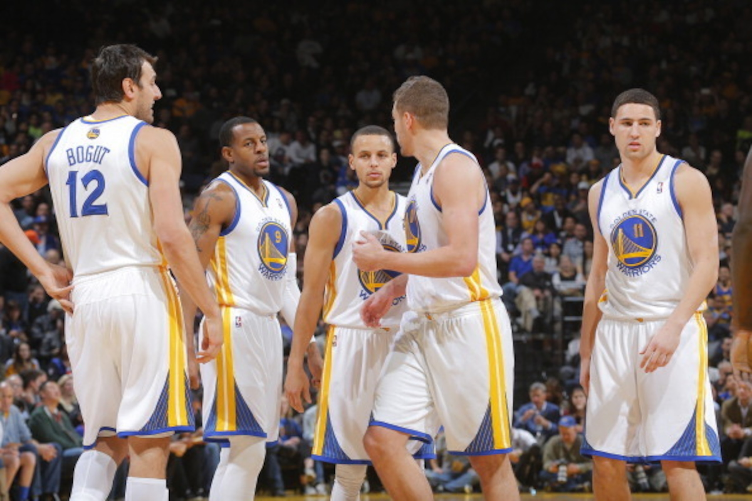 OAKLAND, CA - JANUARY 20: Andrew Bogut #12, Andre Iguodala #9, Stephen Curry #30, David Lee #10 and Klay Thompson #11 of the Golden State Warriors in a game against the Indiana Pacers on January 20, 2014 at Oracle Arena in Oakland, California. NOTE TO USE