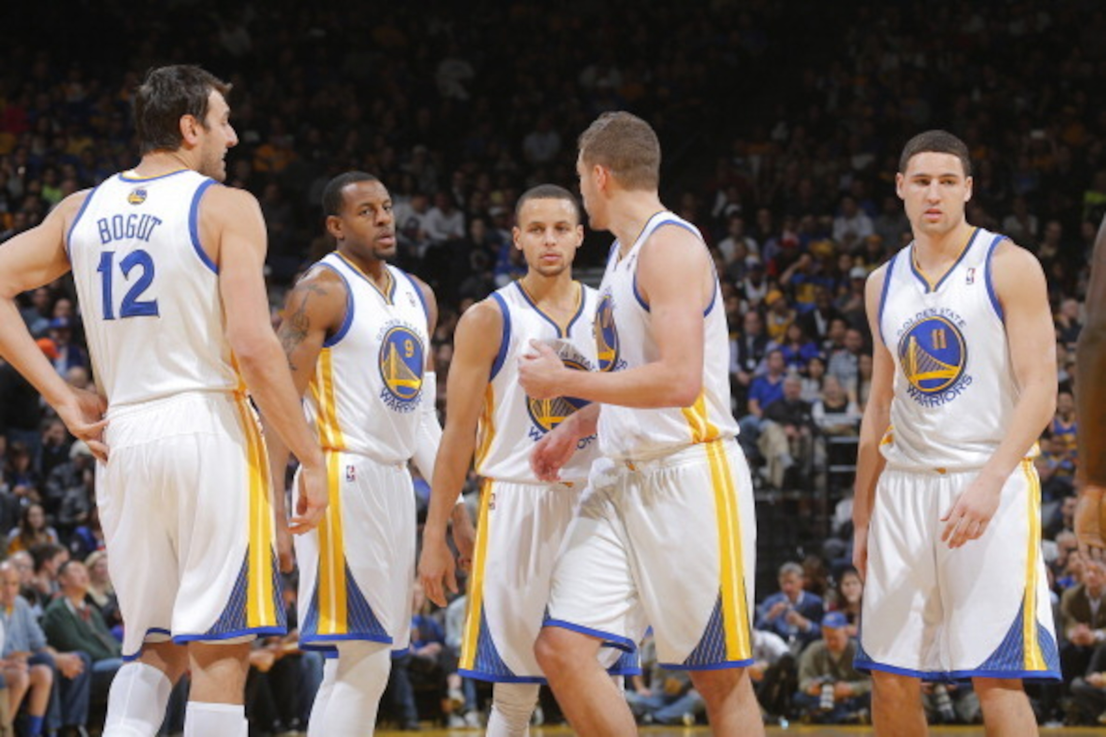 OAKLAND, CA - JANUARY 20: Andrew Bogut #12, Andre Iguodala #9, Stephen Curry #30, David Lee #10 and Klay Thompson #11 of the Golden State Warriors in a game against the Indiana Pacers on January 20, 2014 at Oracle Arena in Oakland, California. NOTE TO USE