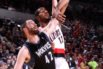 PORTLAND, OR - NOVEMBER 23:  Kevin Love #42 of the Minnesota Timberwolves boxes out LaMarcus Aldridge #12 of the Portland Trail Blazers on November 23, 2012 at the Rose Garden Arena in Portland, Oregon. NOTE TO USER: User expressly acknowledges and agrees
