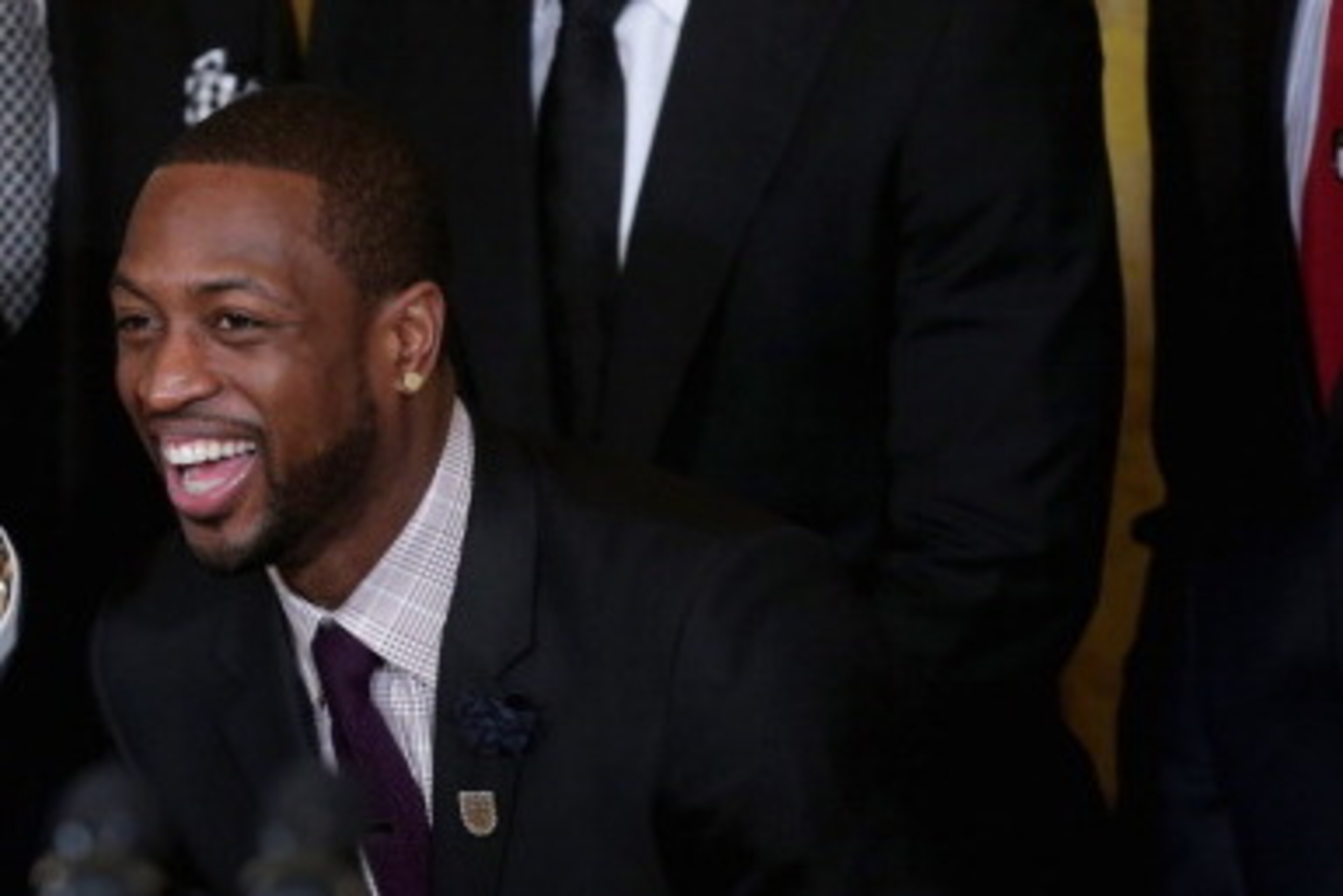 WASHINGTON, DC - JANUARY 14:  National Basketball Association 2012-2013 champion Miami Heat players LeBron James, Juwan Howard, Dwyane Wade and Udonis Haslem share a laugh during an event in the East Room of the White House January 14, 2014 in Washington,
