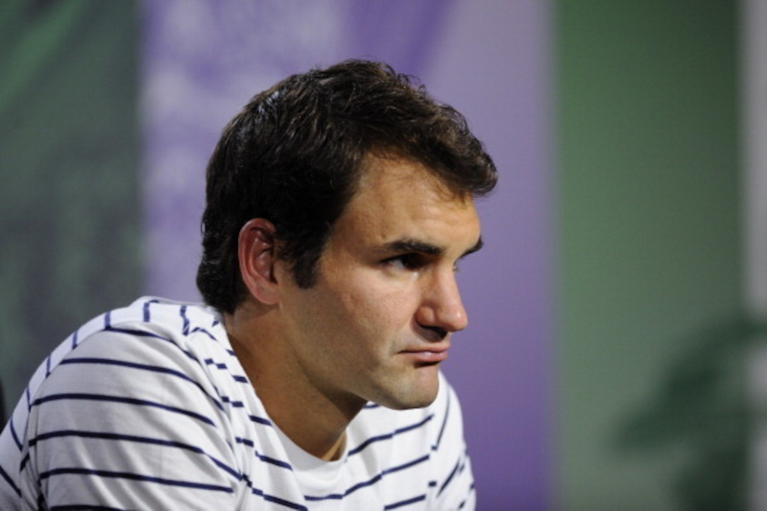 LONDON, ENGLAND - JUNE 26: Roger Federer of Switzerland speaks to members of the media during a press conference on day three of the Wimbledon Lawn Tennis Championships at the All England Lawn Tennis and Croquet Club on June 26, 2013 in London, England. LONDON, ENGLAND - JUNE 26: Roger Federer of Switzerland speaks to members of the media during a press conference on day three of the Wimbledon Lawn Tennis Championships at the All England Lawn Tennis and Croquet Club on June 26, 2013 in London, England.