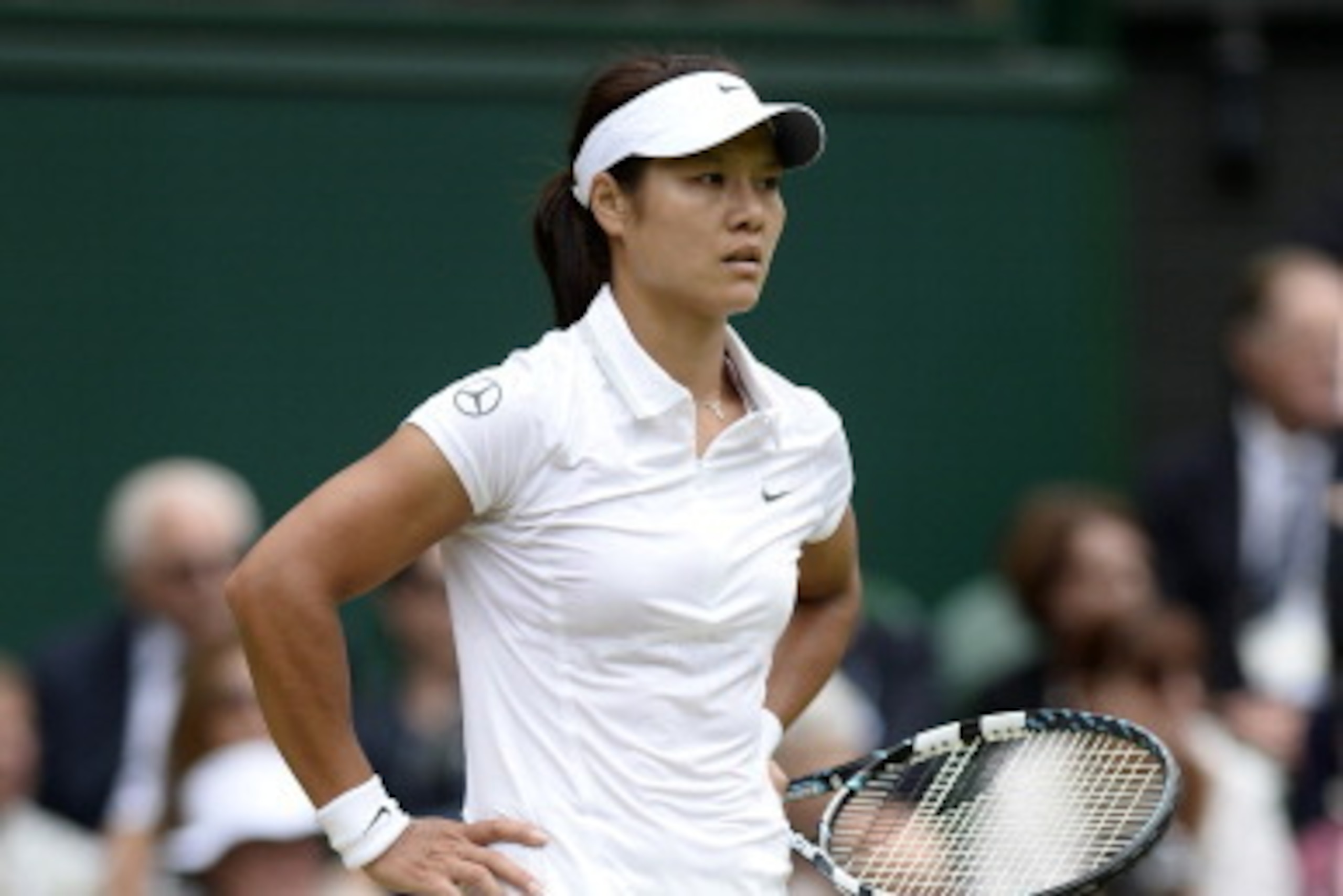 LONDON, ENGLAND - JULY 02: Na Li of China reacts during the Ladies' Singles quarter-final match against Agnieszka Radwanska of Poland on day eight of the Wimbledon Lawn Tennis Championships at the All England Lawn Tennis and Croquet Club at Wimbledon on LONDON, ENGLAND - JULY 02: Na Li of China reacts during the Ladies' Singles quarter-final match against Agnieszka Radwanska of Poland on day eight of the Wimbledon Lawn Tennis Championships at the All England Lawn Tennis and Croquet Club at Wimbledon on