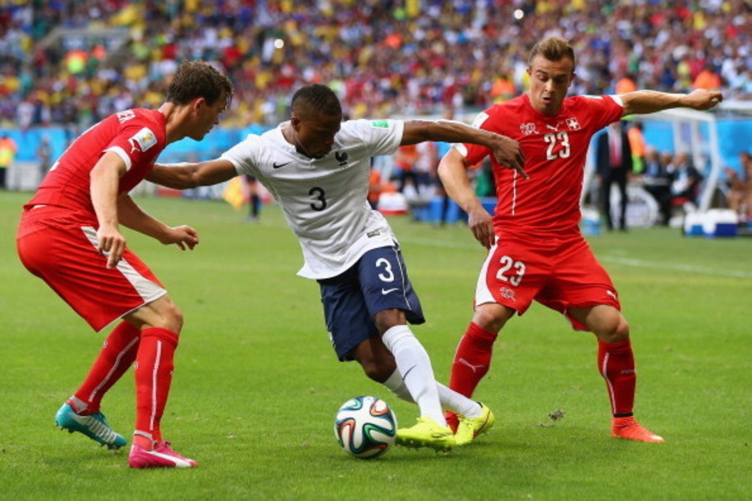 SALVADOR, BRAZIL - JUNE 20:  Patrice Evra of France controls the ball as Mickael Landreau of France give chase during the 2014 FIFA World Cup Brazil Group E match between Switzerland and France at Arena Fonte Nova on June 20, 2014 in Salvador, Brazil.  (P
