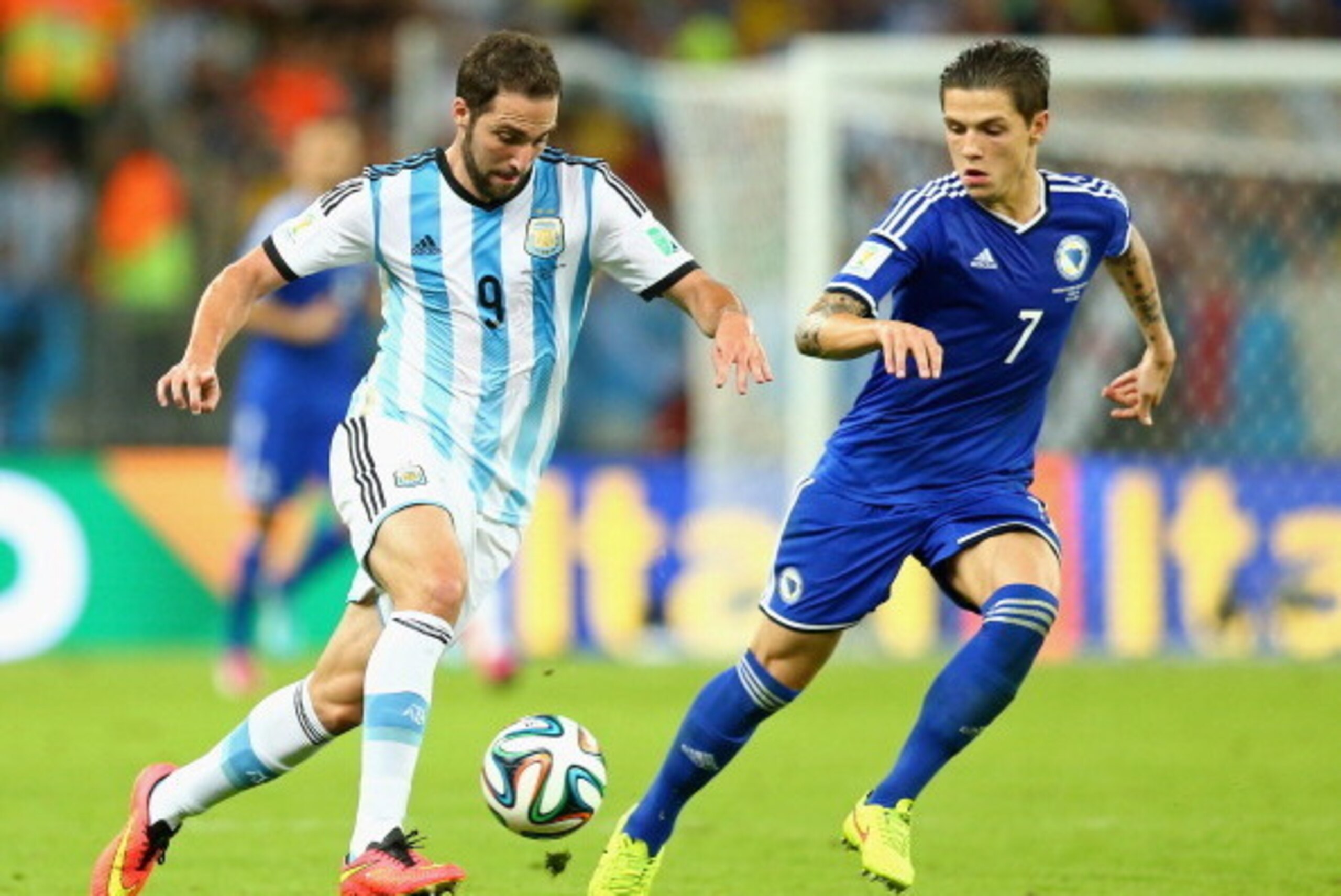 RIO DE JANEIRO, BRAZIL - JUNE 15: Gonzalo Higuain of Argentina and Muhamed Besic of Bosnia and Herzegovina battle for the ball during the 2014 FIFA World Cup Brazil Group F match between Argentina and Bosnia-Herzegovina at Maracana on June 15, 2014 in R RIO DE JANEIRO, BRAZIL - JUNE 15: Gonzalo Higuain of Argentina and Muhamed Besic of Bosnia and Herzegovina battle for the ball during the 2014 FIFA World Cup Brazil Group F match between Argentina and Bosnia-Herzegovina at Maracana on June 15, 2014 in R