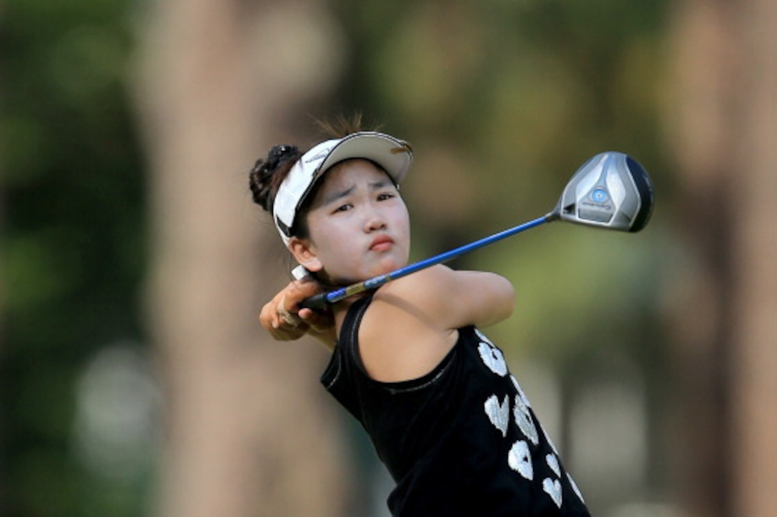 PINEHURST, NC - JUNE 20:  Lucy Li of the USA the 11 year old amateur plays her tee shot to the par 4, 18th hole during the second round of the 69th U.S. Women's Open at Pinehurst Resort & Country Club, Course No. 2, on June 20, 2014 in Pinehurst, North Ca