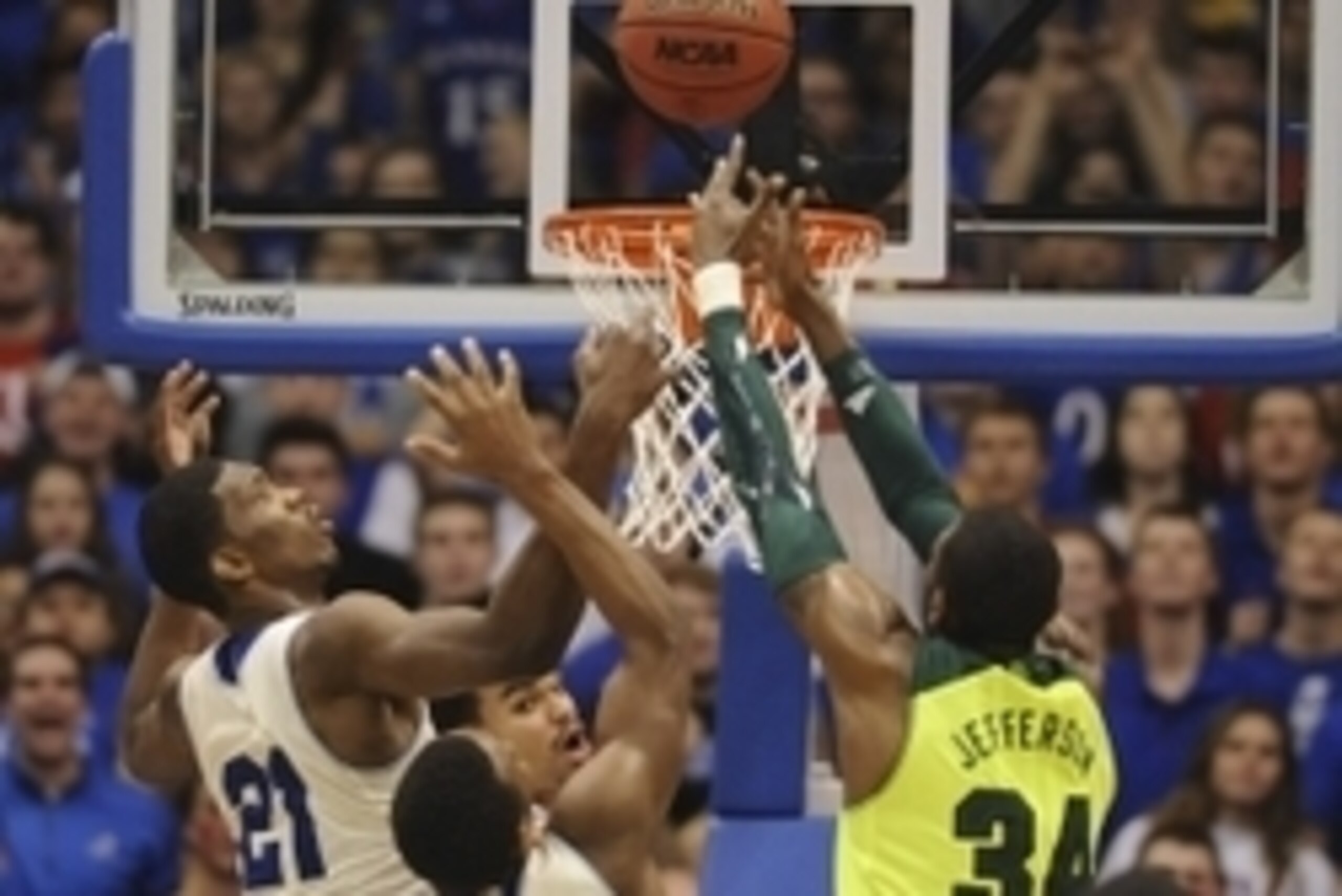 Jan 20, 2014; Lawrence, KS, USA; Kansas Jayhawks center Joel Embiid (21) and Baylor Bears forward Cory Jefferson (34) fight for a rebound during the second half at Allen Fieldhouse. Kansas won 78-68. Mandatory Credit: Denny Medley-USA TODAY Sports