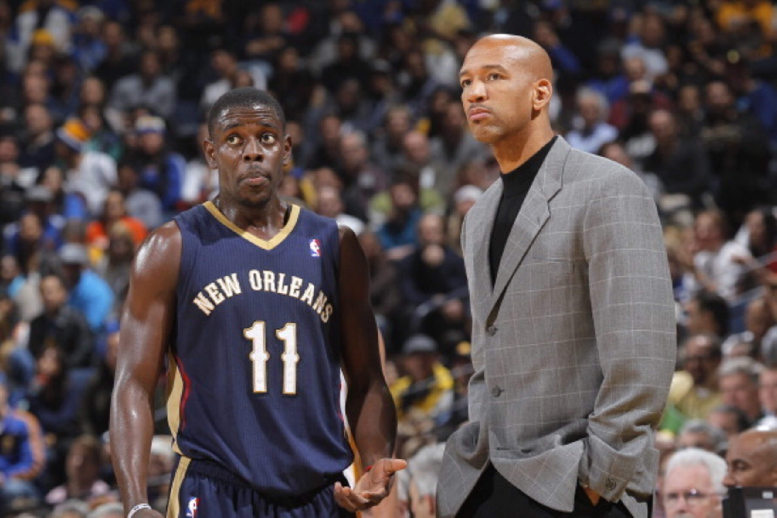 OAKLAND, CA - DECEMBER 17: Jrue Holiday #11 of the New Orleans Pelicans talks with Head coach Monty Williams during a game against the Golden State Warriors on December 17, 2013 at Oracle Arena in Oakland, California. NOTE TO USER: User expressly acknowle