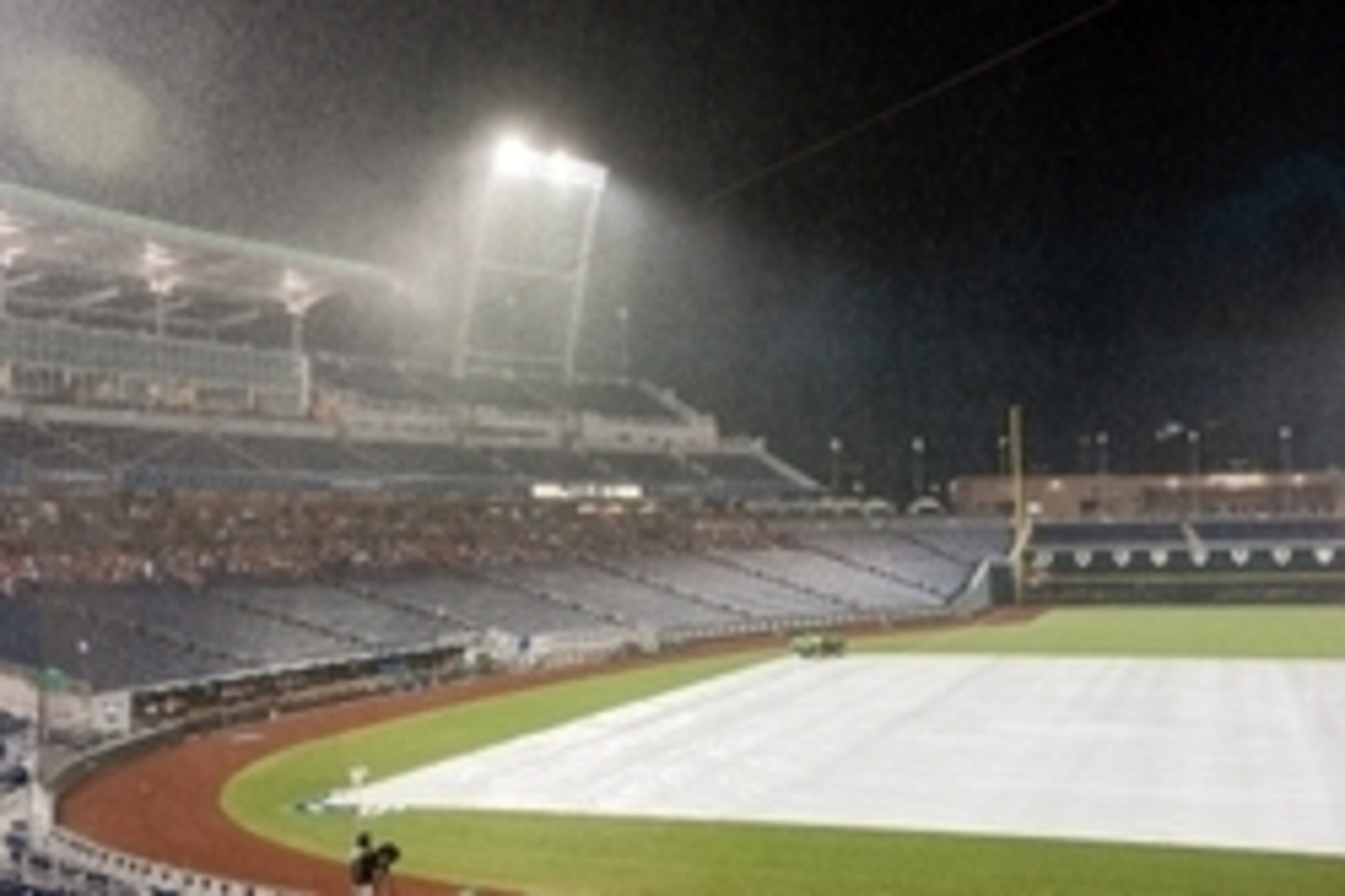 Jun 20, 2014; Omaha, NE, USA; Fans wait out a rain delay during game twelve of the 2014 College World Series between the Mississippi Rebels and the Virginia Cavaliers at TD Ameritrade Park Omaha. Mandatory Credit: Steven Branscombe-USA TODAY Sports Jun 20, 2014; Omaha, NE, USA; Fans wait out a rain delay during game twelve of the 2014 College World Series between the Mississippi Rebels and the Virginia Cavaliers at TD Ameritrade Park Omaha. Mandatory Credit: Steven Branscombe-USA TODAY Sports