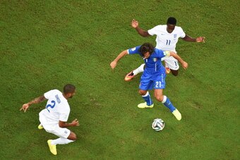 MANAUS, BRAZIL - JUNE 14:  Glen Johnson and Danny Welbeck of England close down Andrea Pirlo of Italy during the 2014 FIFA World Cup Brazil Group D match between England and Italy at Arena Amazonia on June 14, 2014 in Manaus, Brazil.  (Photo by Pool/Getty
