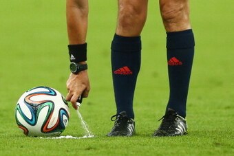 RIO DE JANEIRO, BRAZIL - JUNE 15: Referee Joel Aguilar sprays a temporary line for a free kick during the 2014 FIFA World Cup Brazil Group F match between Argentina and Bosnia-Herzegovina at Maracana on June 15, 2014 in Rio de Janeiro, Brazil.  (Photo by 
