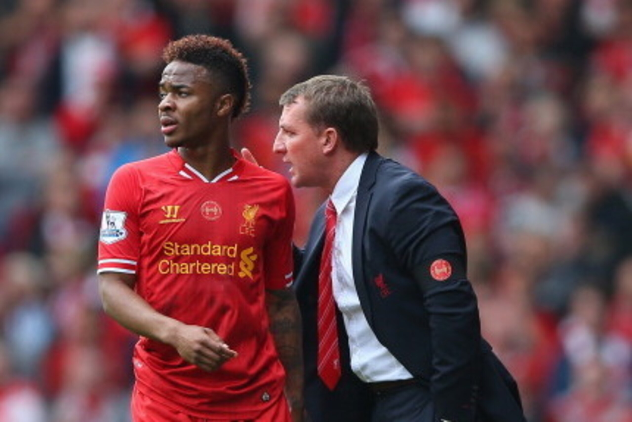 LIVERPOOL, ENGLAND - APRIL 27: Liverpool manager Brendan Rodgers gives instructions to Raheem Sterling during the Barclays Premier League match between Liverpool and Chelsea at Anfield on April 27, 2014 in Liverpool, England.  (Photo by Clive Brunskill/Ge