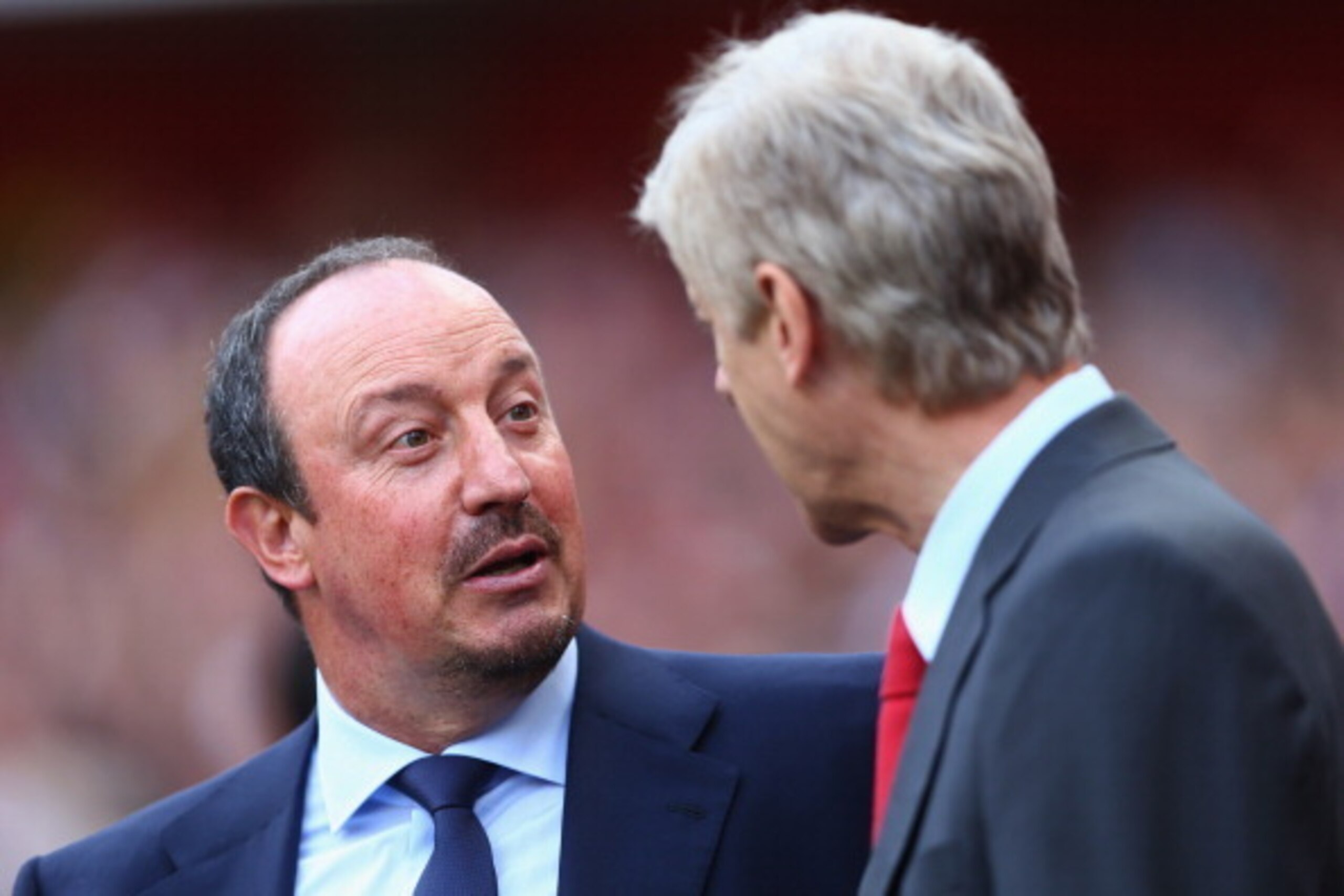 LONDON, ENGLAND - AUGUST 03:  Manager Rafael Benitez of Napoli talks to manager Arsene Wenger of Arsenal during the match between Arsenal and Napoli at Emirates Stadium on August 3, 2013 in London, England.  (Photo by Paul Gilham/Getty Images)