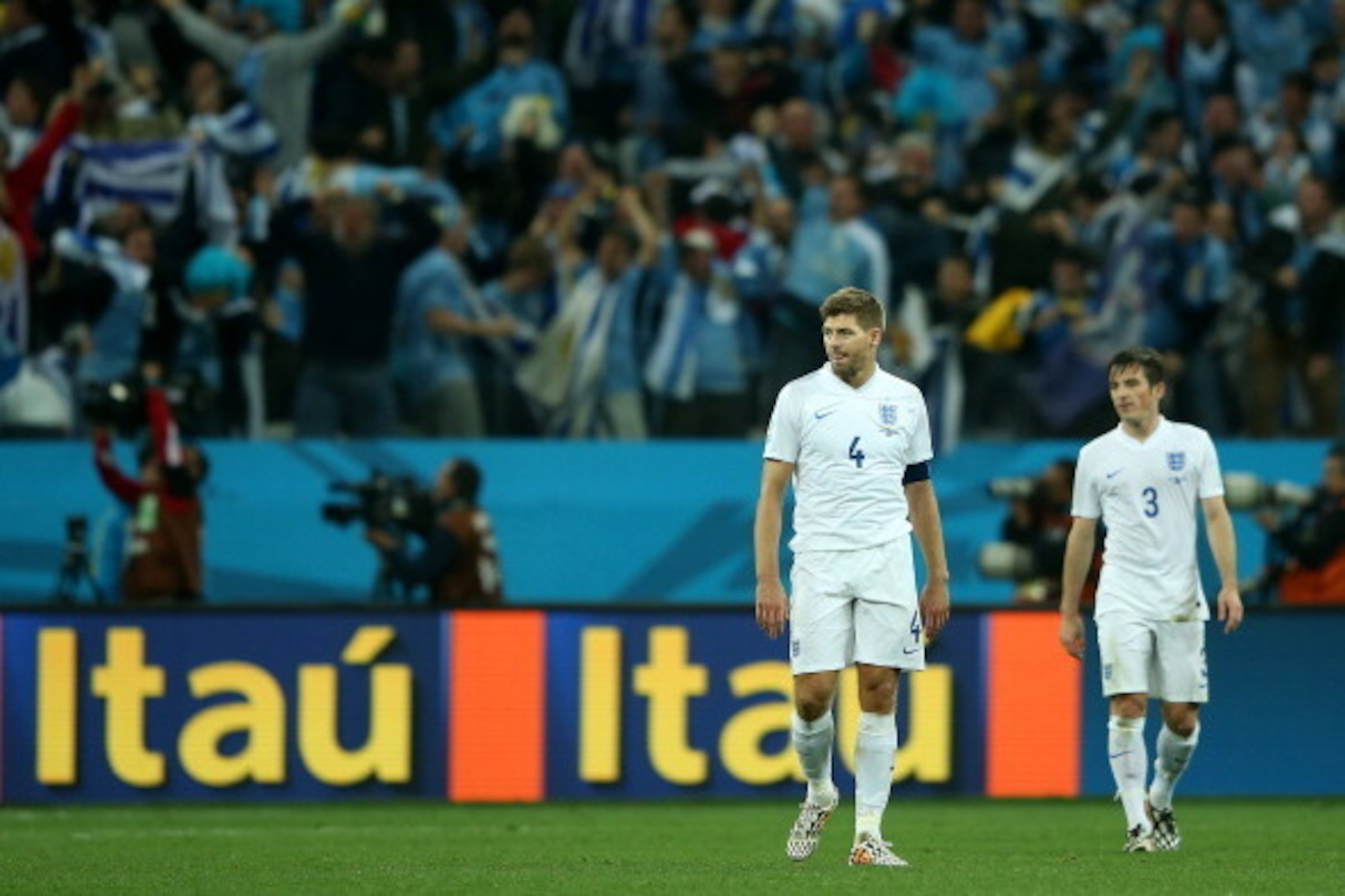 SAO PAULO, BRAZIL - JUNE 19:  A dejected Steven Gerrard of England walks on after losing to Uruguay 2-1 during the 2014 FIFA World Cup Brazil Group D match between Uruguay and England at Arena de Sao Paulo on June 19, 2014 in Sao Paulo, Brazil.  (Photo by