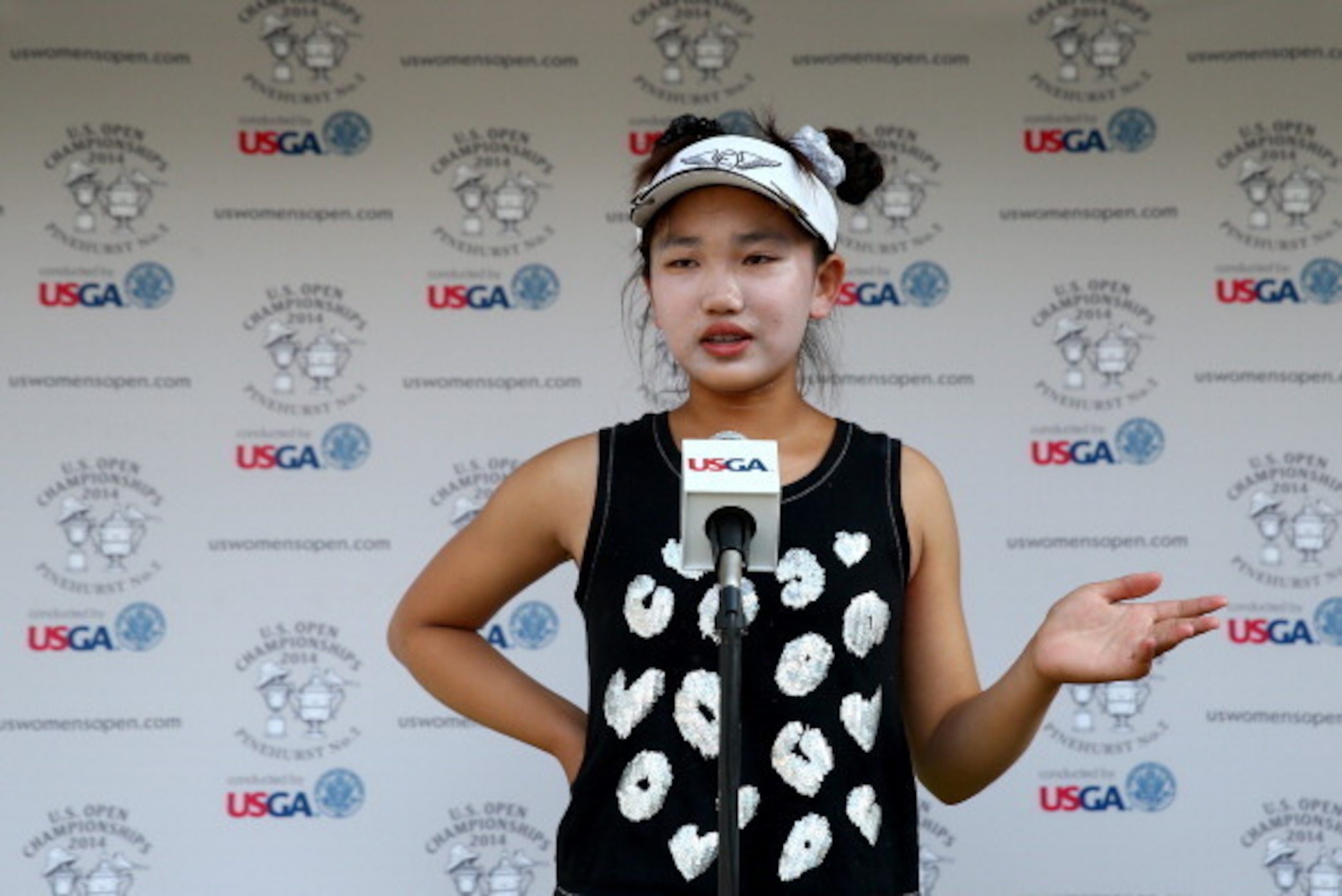 PINEHURST, NC - JUNE 20:  Eleven-year old Amateur Lucy Li of the United States speaks to the media after the second round of the 69th U.S. Women's Open at Pinehurst Resort & Country Club, Course No. 2 on June 20, 2014 in Pinehurst, North Carolina.  (Photo
