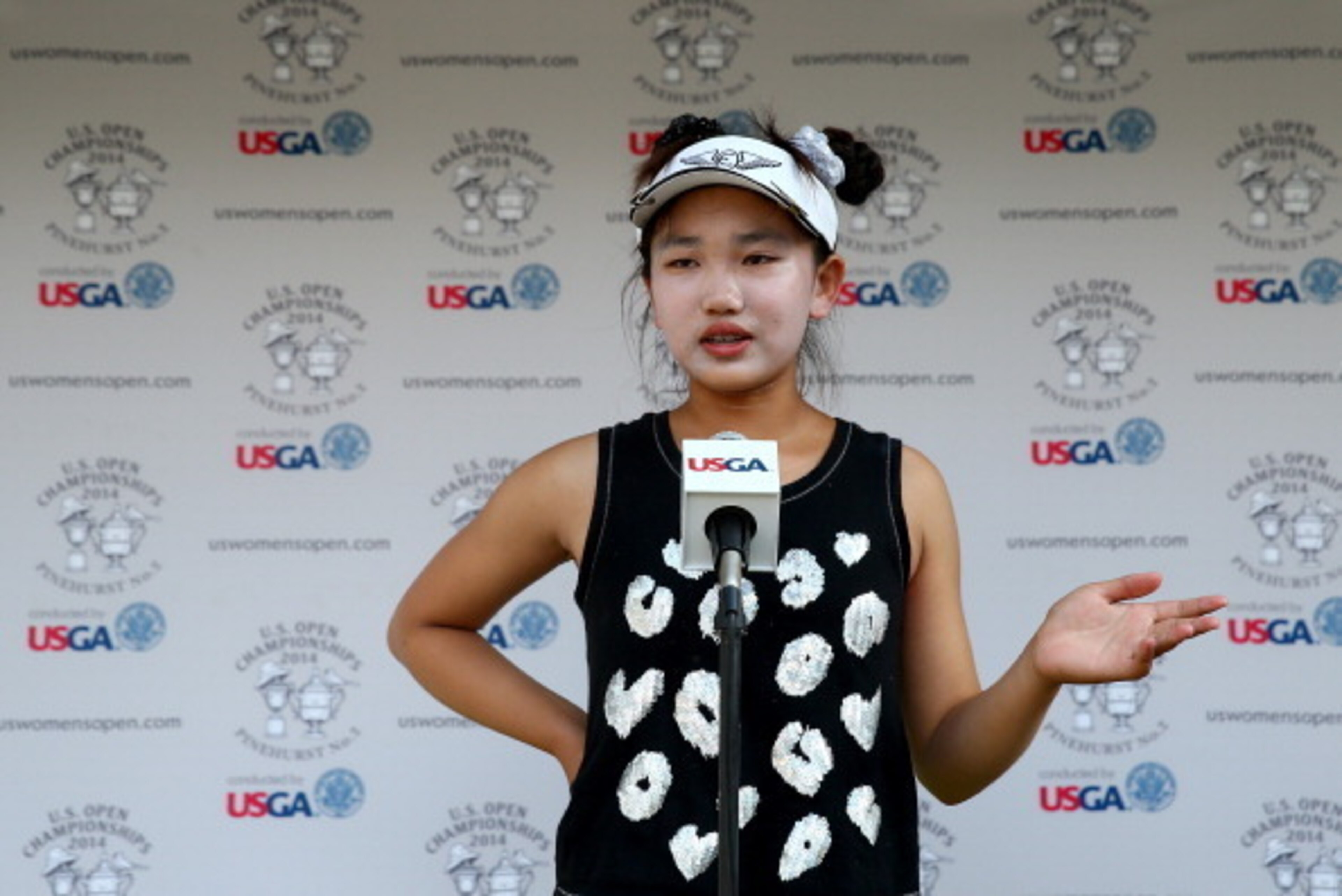 PINEHURST, NC - JUNE 20:  Eleven-year old Amateur Lucy Li of the United States speaks to the media after the second round of the 69th U.S. Women's Open at Pinehurst Resort & Country Club, Course No. 2 on June 20, 2014 in Pinehurst, North Carolina.  (Photo