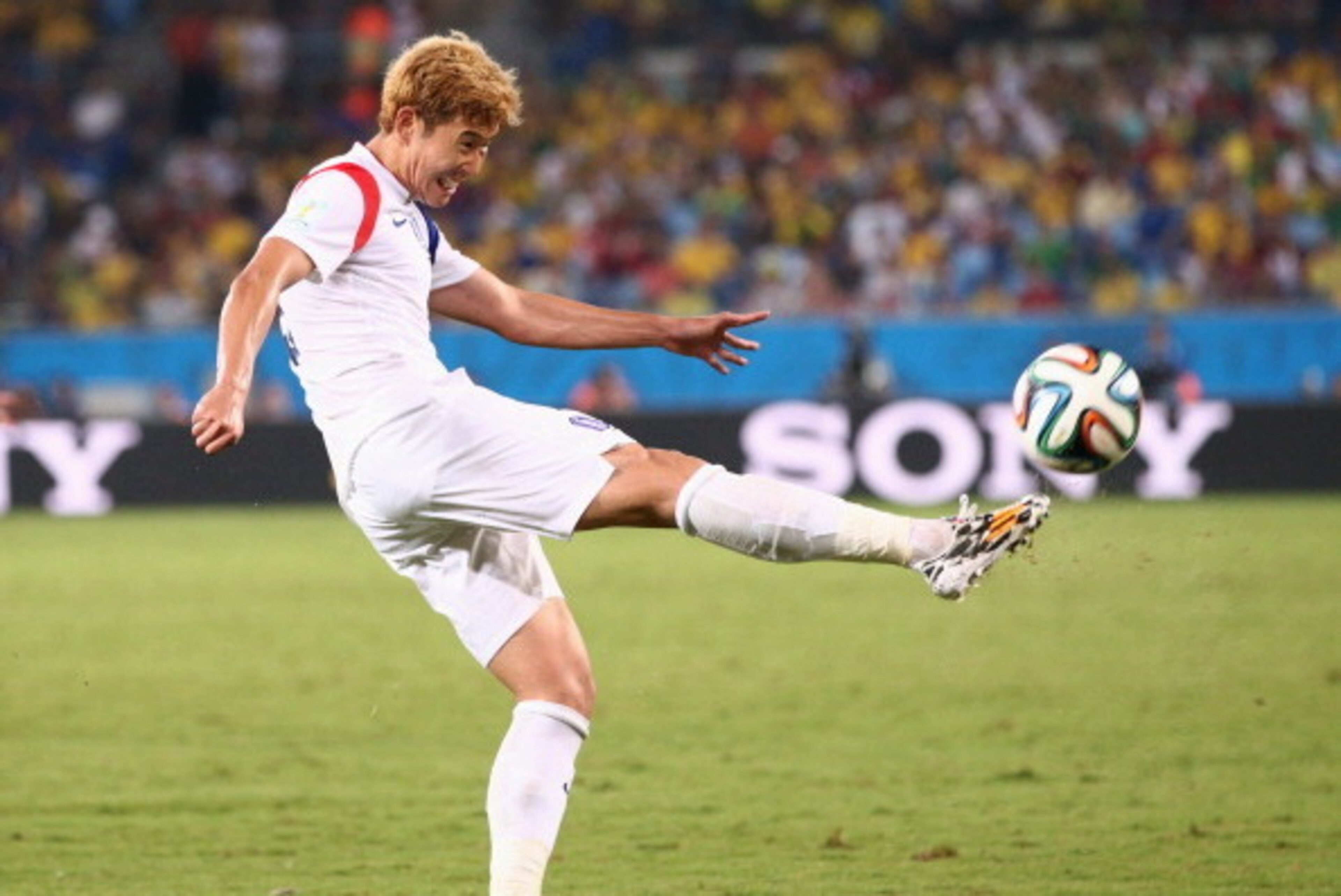 CUIABA, BRAZIL - JUNE 17: Son Heung-Min of South Korea strikes the ball during the 2014 FIFA World Cup Brazil Group H match between Russia and South Korea at Arena Pantanal on June 17, 2014 in Cuiaba, Brazil.  (Photo by Adam Pretty/Getty Images)