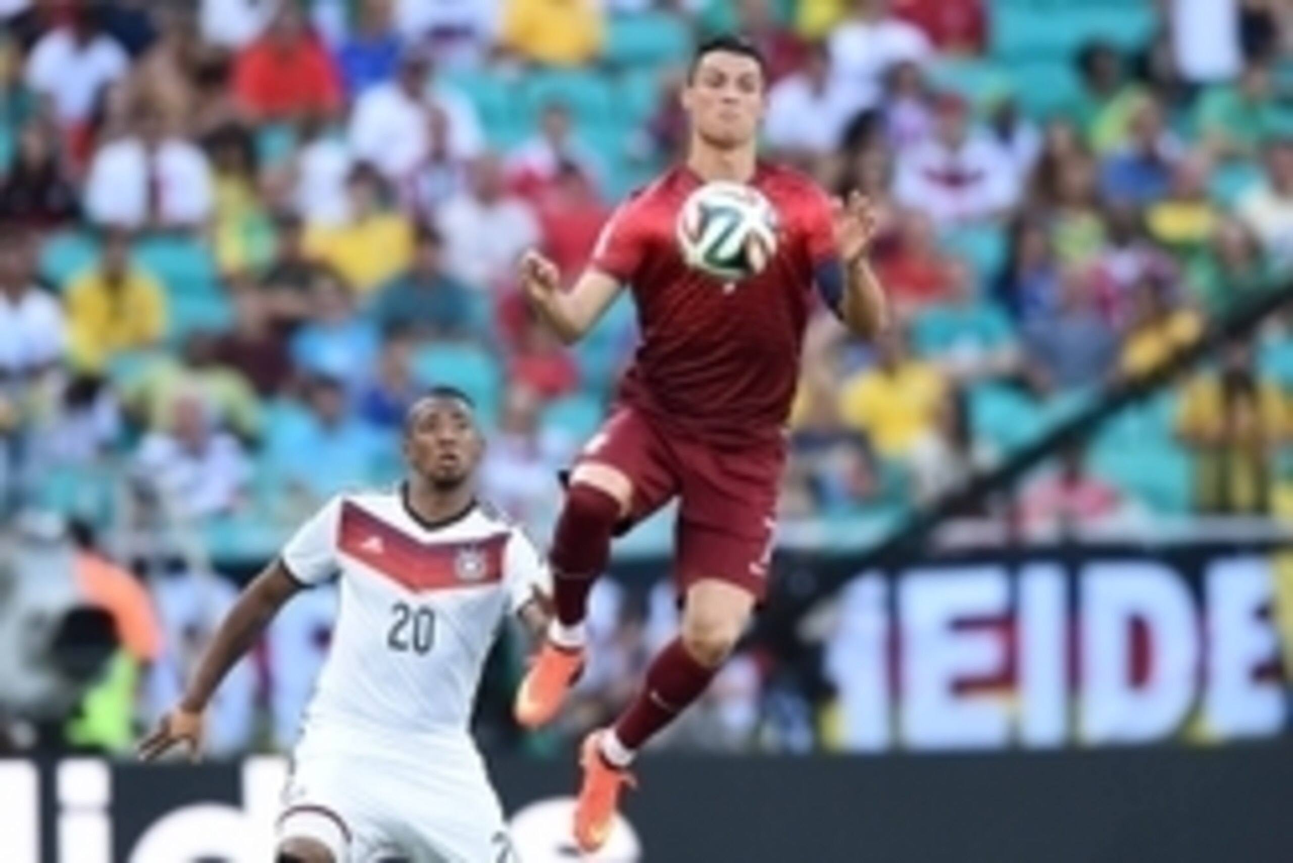 June 16, 2014; Salvador, BRAZIL; Portugal player Cristiano Ronaldo (7) goes up for the ball in front of Germany player Jerome Boateng (20) during Group G play during the 2014 World Cup at Arena Fonte Nova.  Mandatory Credit: Tim Groothuis/Witters Sport vi