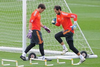 MADRID, SPAIN - OCTOBER 22:  Iker Casillas (L) and Diego Lopez during a training session ahead of their UEFA Champions League Group B match against Juventus, at Valdebebas training ground on October 22, 2013 in Madrid, Spain. (Photo by Denis Doyle/Getty I