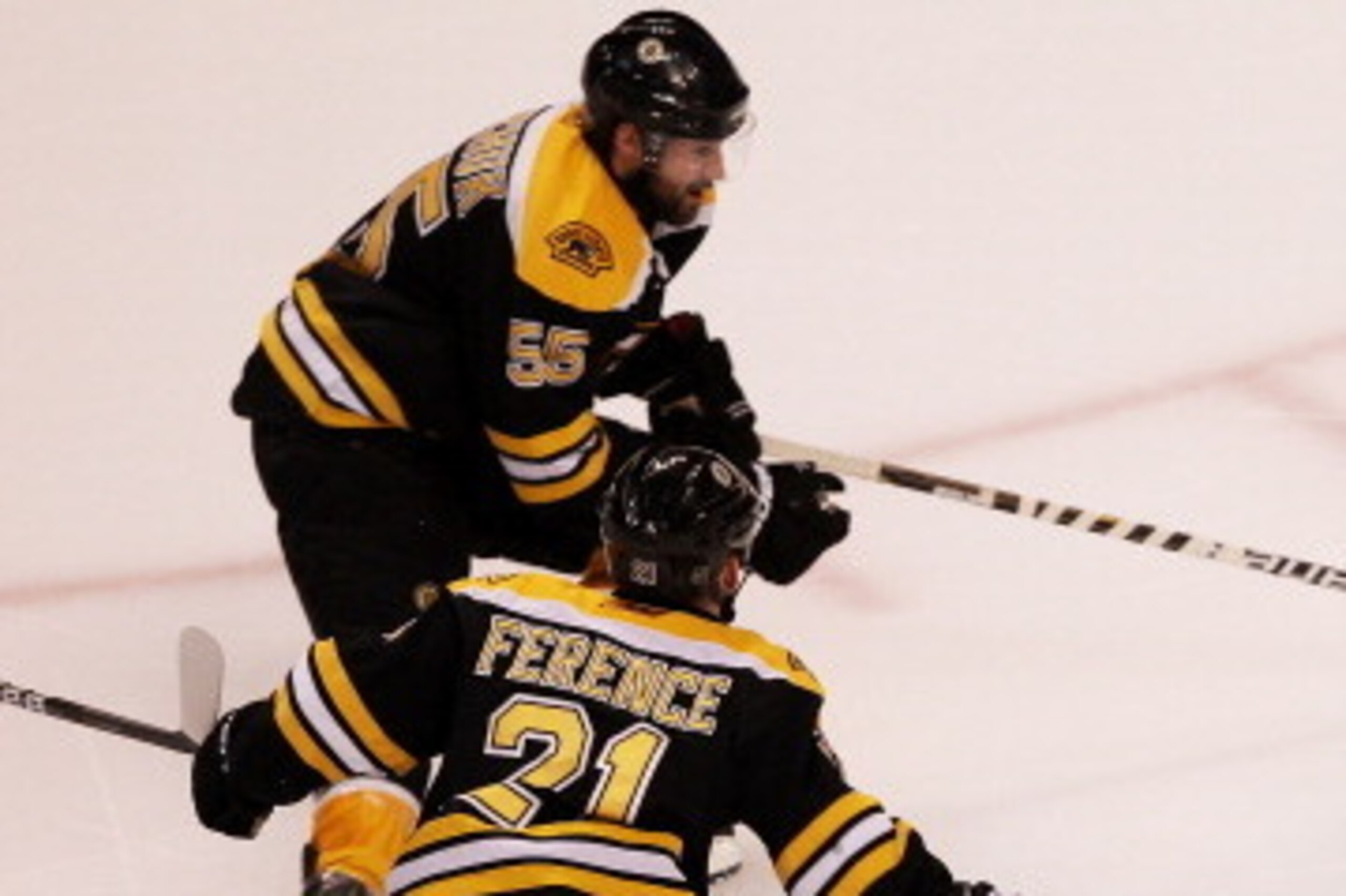 BOSTON, MA - MAY 17:  Martin St. Louis #26 of the Tampa Bay Lightning controls the puck against Andrew Ference #21 and Johnny Boychuk #55 of the Boston Bruins in Game Two of the Eastern Conference Finals during the 2011 NHL Stanley Cup Playoffs at TD Gard