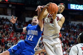 LAS VEGAS, NV - JANUARY 04: Max Yon #22 of the Air Force Falcons and Khem Birch #2 of the UNLV Rebels fight for a rebound during their game at the Thomas & Mack Center on January 4, 2014 in Las Vegas, Nevada. Air Force won 75-68. (Photo by Ethan Miller/ LAS VEGAS, NV - JANUARY 04: Max Yon #22 of the Air Force Falcons and Khem Birch #2 of the UNLV Rebels fight for a rebound during their game at the Thomas & Mack Center on January 4, 2014 in Las Vegas, Nevada. Air Force won 75-68. (Photo by Ethan Miller/