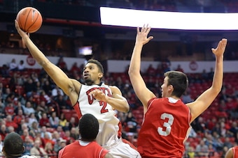 LAS VEGAS, NV - DECEMBER 20: Khem Birch #2 of the UNLV Rebels drives past Chris Evans #11 and Cole Walton #3 of the Sacred Heart Pioneers during their game at the Thomas & Mack Center on December 20, 2013 in Las Vegas, Nevada. UNLV won 82-50. (Photo by LAS VEGAS, NV - DECEMBER 20: Khem Birch #2 of the UNLV Rebels drives past Chris Evans #11 and Cole Walton #3 of the Sacred Heart Pioneers during their game at the Thomas & Mack Center on December 20, 2013 in Las Vegas, Nevada. UNLV won 82-50. (Photo by