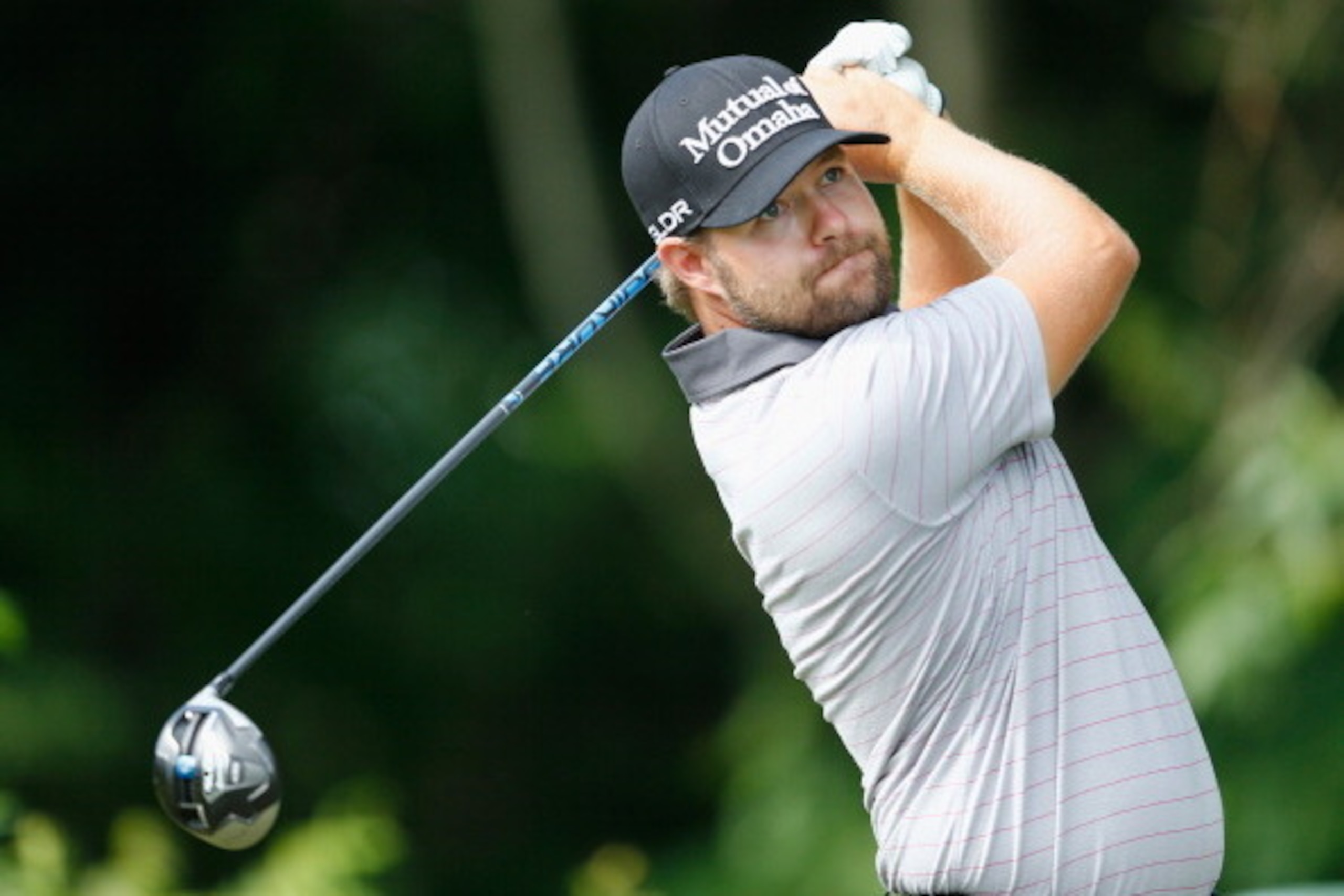 CROMWELL, CT - JUNE 21: Ryan Moore of the United States watches his tee shot on the 12th hole during the third round of the Travelers Championship golf tournament at the TPC River Highlands on June 21, 2014 in Cromwell, Connecticut.  (Photo by Jim Rogash/