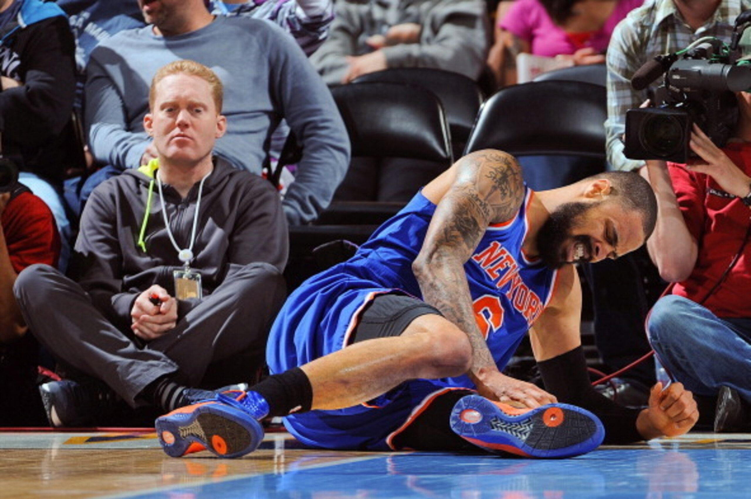DENVER, CO - MARCH 13: Tyson Chandler #6 of the New York Knicks reacts after bruising his knee during play against the Denver Nuggets on March 13, 2013 at the Pepsi Center in Denver, Colorado. NOTE TO USER: User expressly acknowledges and agrees that, by 