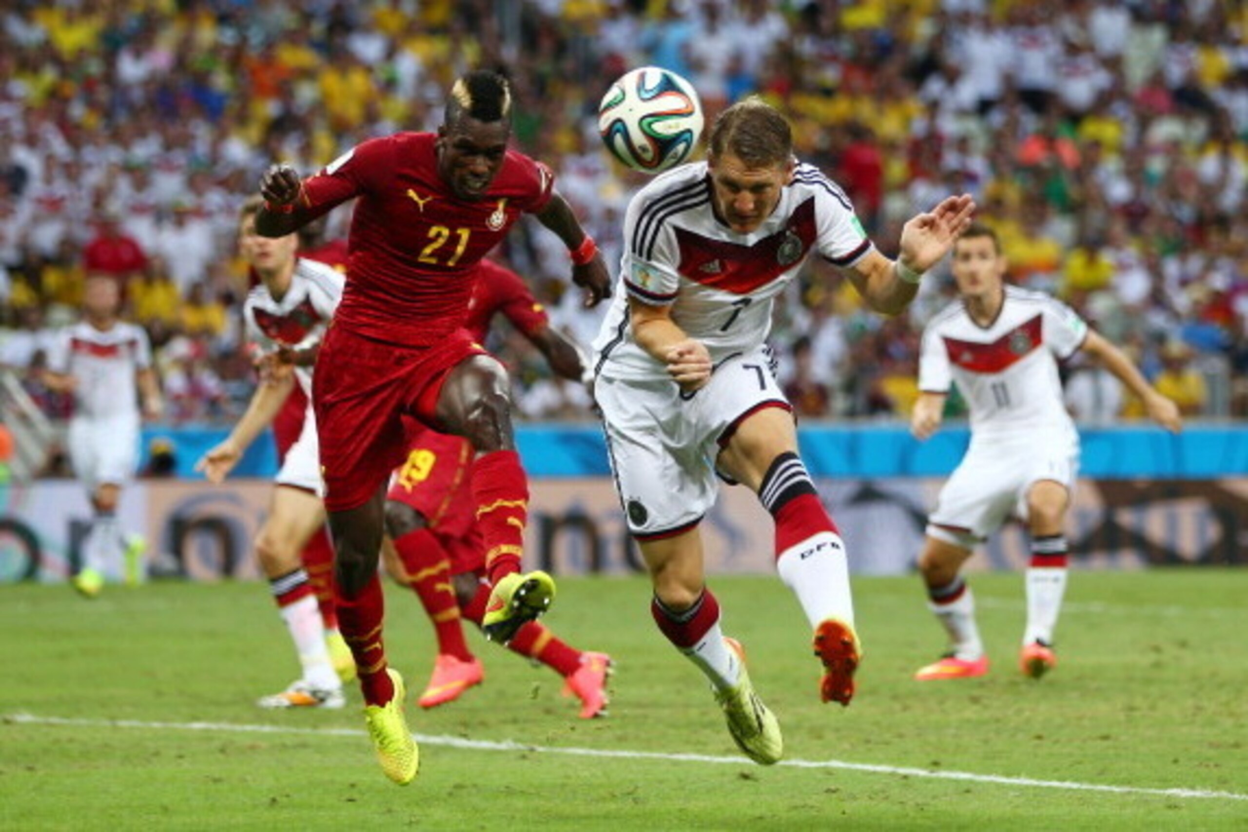 FORTALEZA, BRAZIL - JUNE 21:  John Boye of Ghana and Bastian Schweinsteiger of Germany go up for a header during the 2014 FIFA World Cup Brazil Group G match between Germany and Ghana at Castelao on June 21, 2014 in Fortaleza, Brazil.  (Photo by Michael S