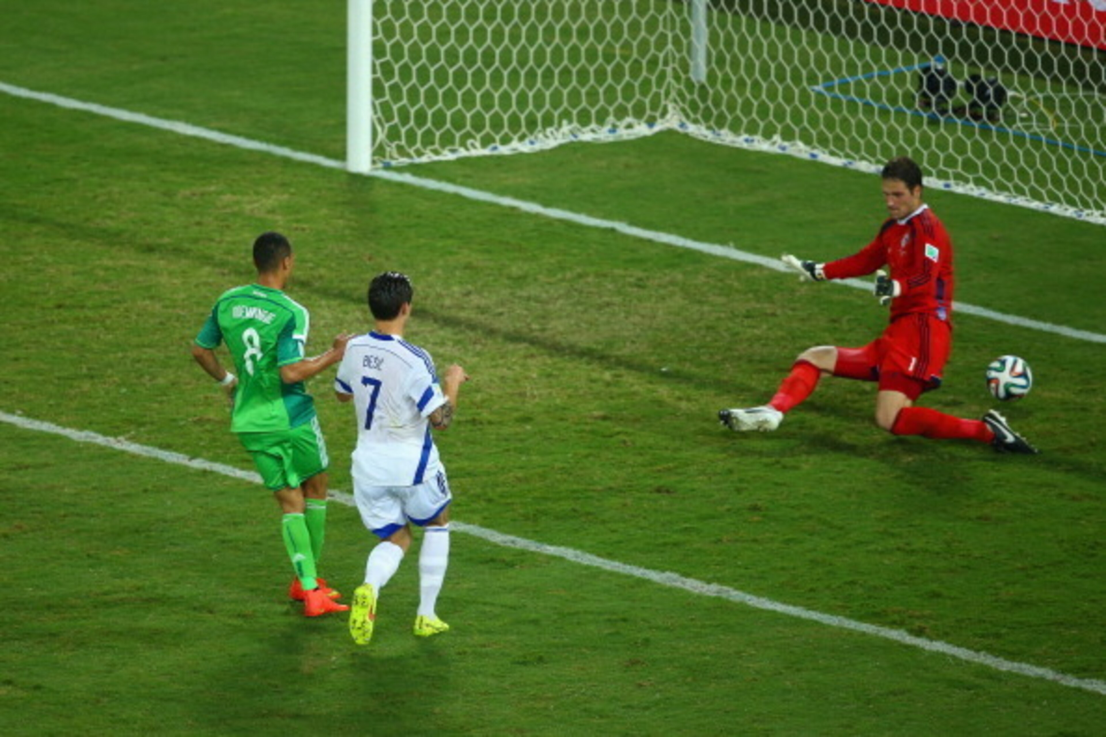CUIABA, BRAZIL - JUNE 21: Peter Odemwingie of Nigeria scores his team's first goal past Asmir Begovic of Bosnia and Herzegovina during the 2014 FIFA World Cup Group F match between Nigeria and Bosnia-Herzegovina at Arena Pantanal on June 21, 2014 in Cuiab
