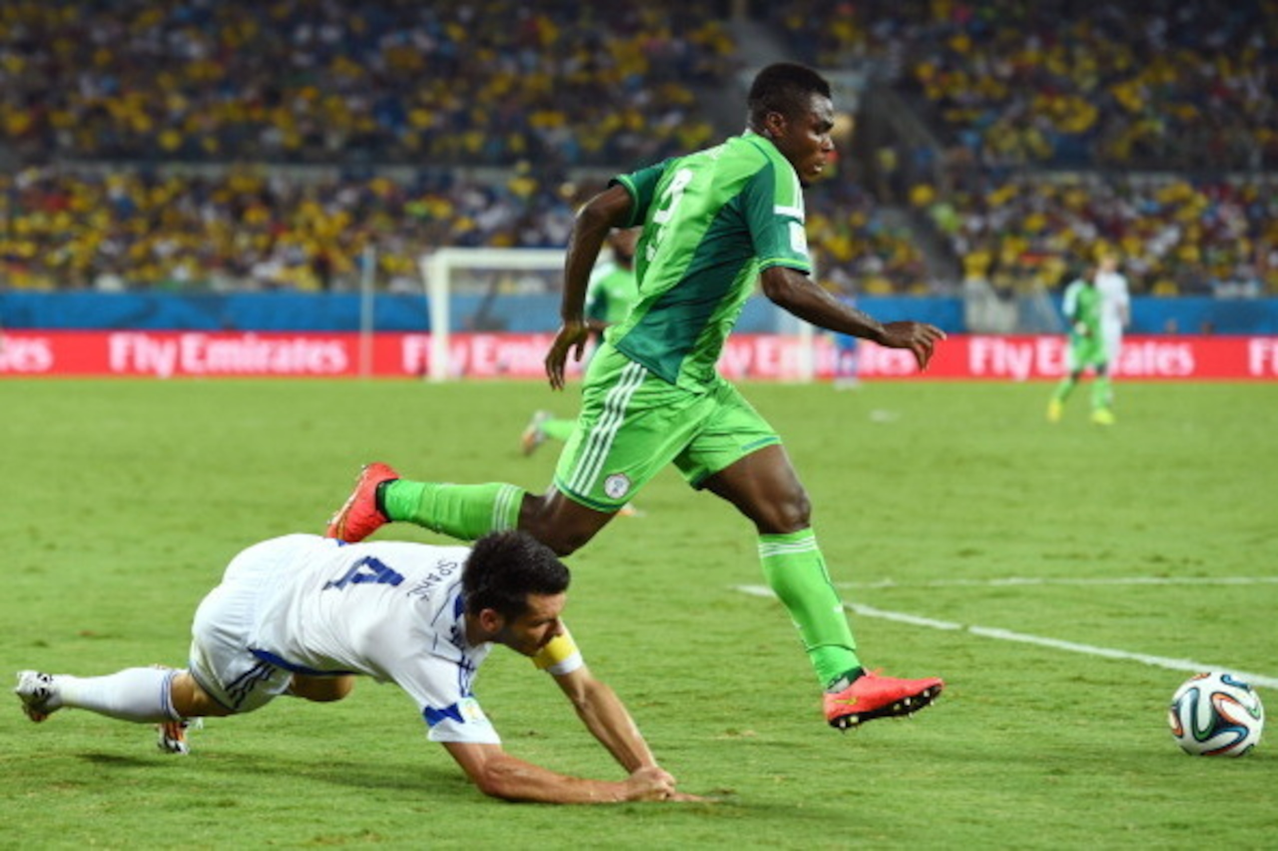 CUIABA, BRAZIL - JUNE 21: Emmanuel Emenike of Nigeria controls the ball against Emir Spahic of Bosnia and Herzegovina during the 2014 FIFA World Cup Group F match between Nigeria and Bosnia-Herzegovina at Arena Pantanal on June 21, 2014 in Cuiaba, Brazil.