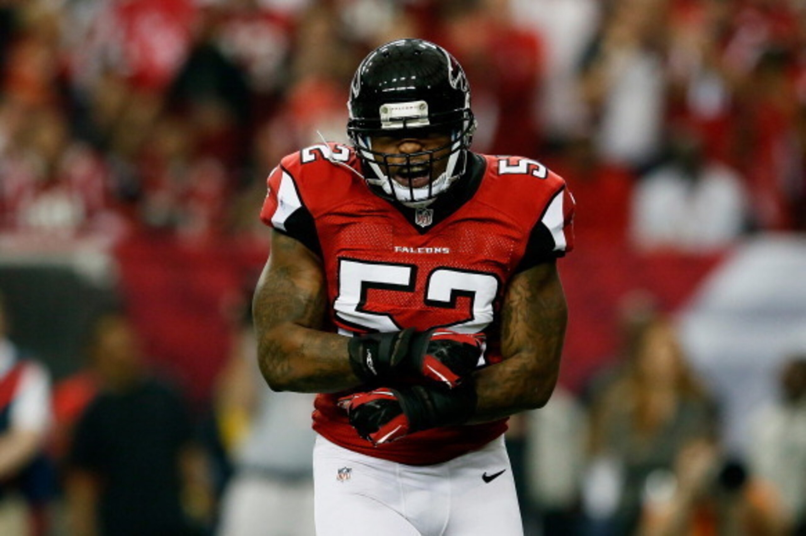 ATLANTA, GA - JANUARY 13:  Akeem Dent #52 of the Atlanta Falcons celebrates stopping  Marshawn Lynch #24 of the Seattle Seahawks in the first quarter of the NFC Divisional Playoff Game at Georgia Dome on January 13, 2013 in Atlanta, Georgia.  (Photo by Ke