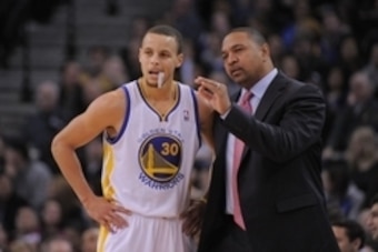 January 11, 2013; Oakland, CA, USA; Golden State Warriors head coach Mark Jackson (right) instructs point guard Stephen Curry (30) during the second quarter against the Portland Trail Blazers at Oracle Arena. Mandatory Credit: Kyle Terada-USA TODAY Sports