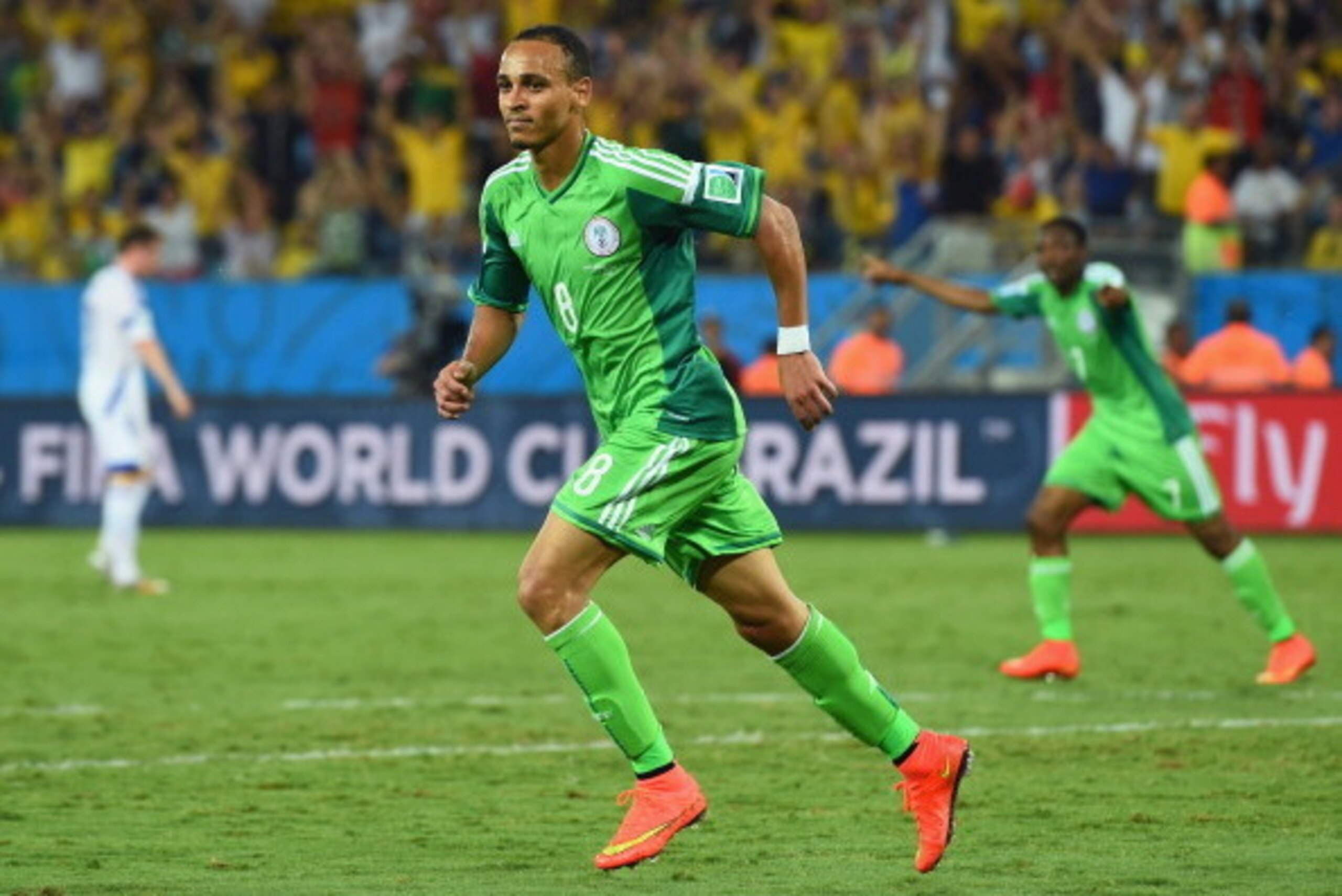 CUIABA, BRAZIL - JUNE 21:  Peter Odemwingie of Nigeria (L) celebrates scoring his team's first goal during the 2014 FIFA World Cup Group F match between Nigeria and Bosnia-Herzegovina at Arena Pantanal on June 21, 2014 in Cuiaba, Brazil.  (Photo by Stu Fo