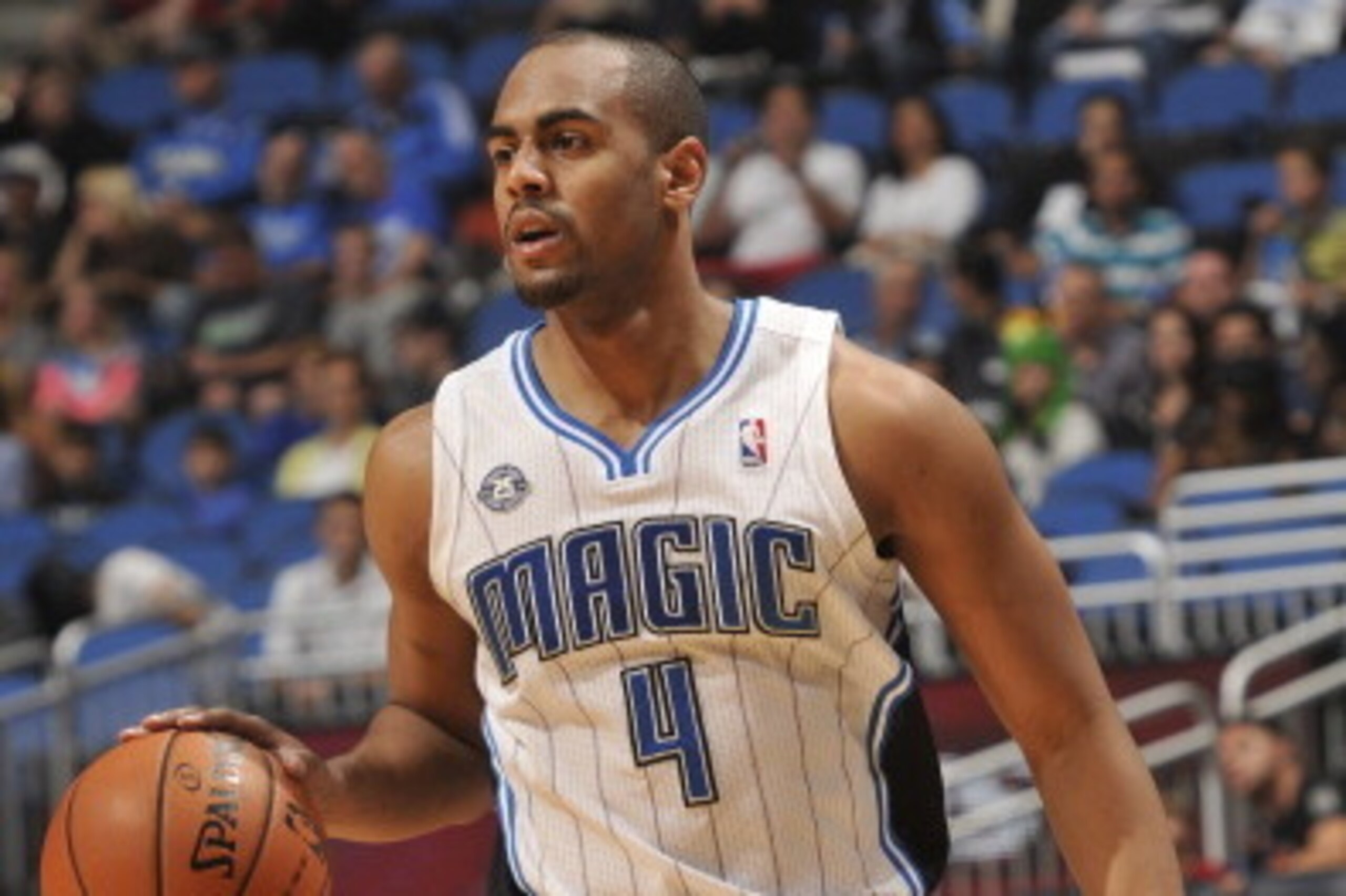 ORLANDO, FL - APRIL 11: Arron Afflalo #4 of the Orlando Magic dribbles the ball against the Washington Wizards during the game on April 11, 2014 at Amway Center in Orlando, Florida. NOTE TO USER: User expressly acknowledges and agrees that, by downloading