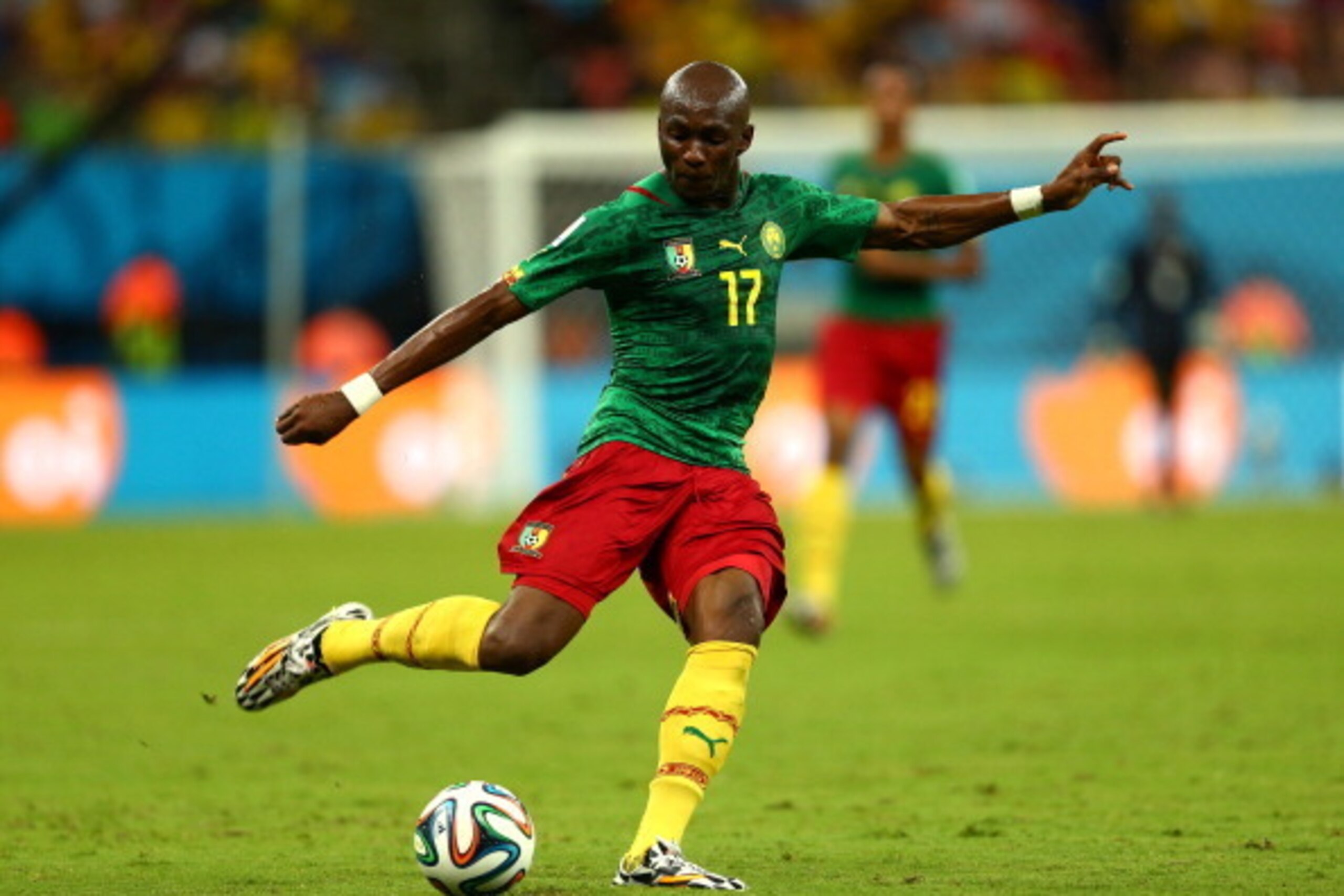 MANAUS, BRAZIL - JUNE 18: Stephane Mbia of Cameroon strikes the ball during the 2014 FIFA World Cup Brazil Group A match between Cameroon and Croatia at Arena Amazonia on June 18, 2014 in Manaus, Brazil.  (Photo by Clive Brunskill/Getty Images)